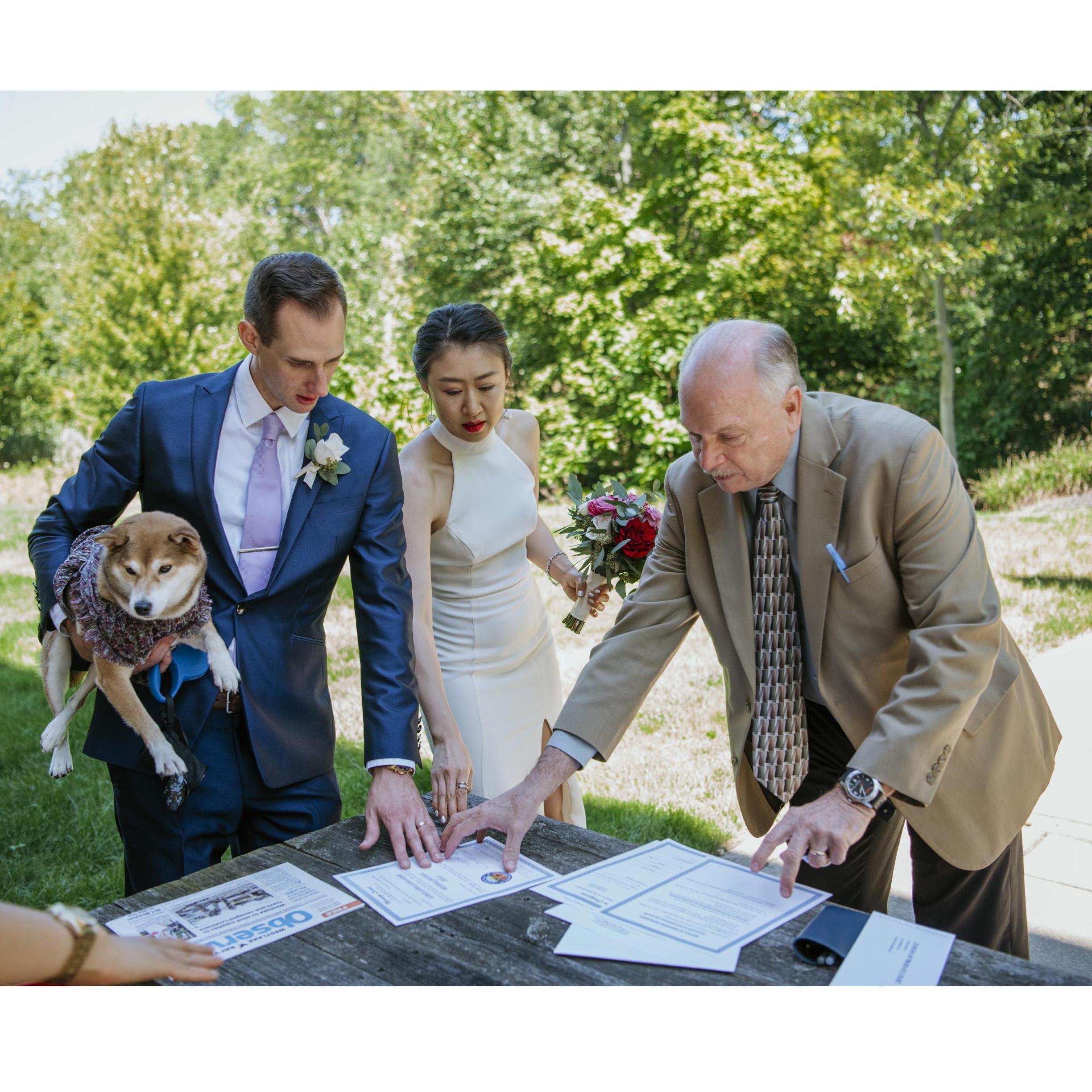 09/04/2020 Wedding Day in Westlake, OH - reviewing the marriage licence with the Mayor