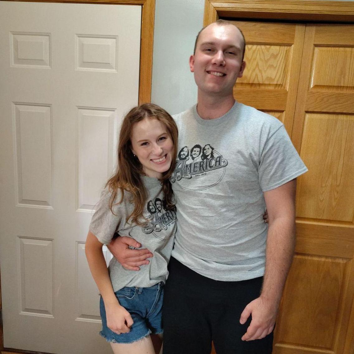 Matching T-shirts from when we went to see America in concert!