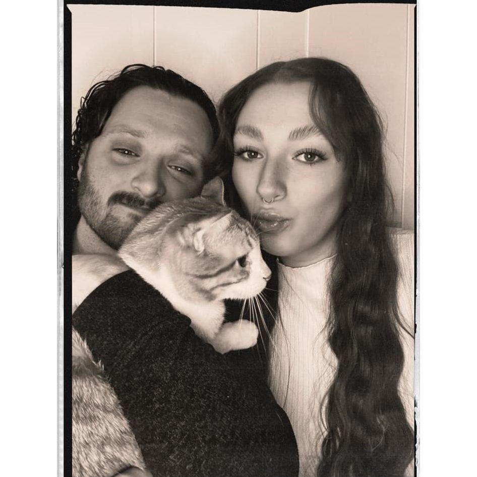 A family photo of us with our orange cat, Cider