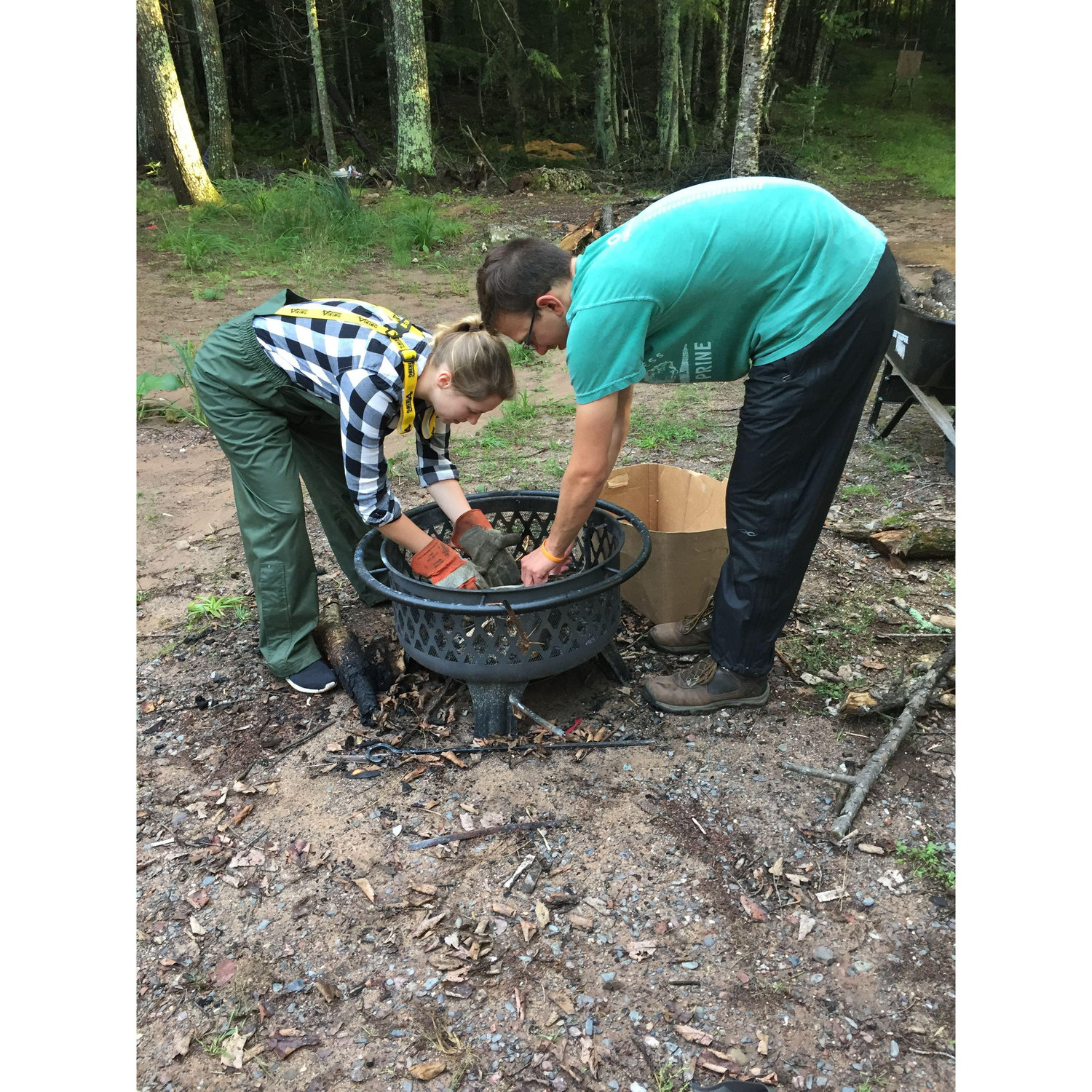 Kevin teaching Abbey how to survive in the woods