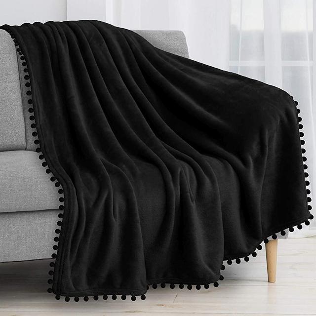 PAVILIA Fleece Throw Blanket with Pom Pom Fringe | Black Flannel Throw | Super Soft Lightweight Microfiber Polyester | Plush, Fuzzy, Cozy, Machine Washable | 50 x 60 Inches