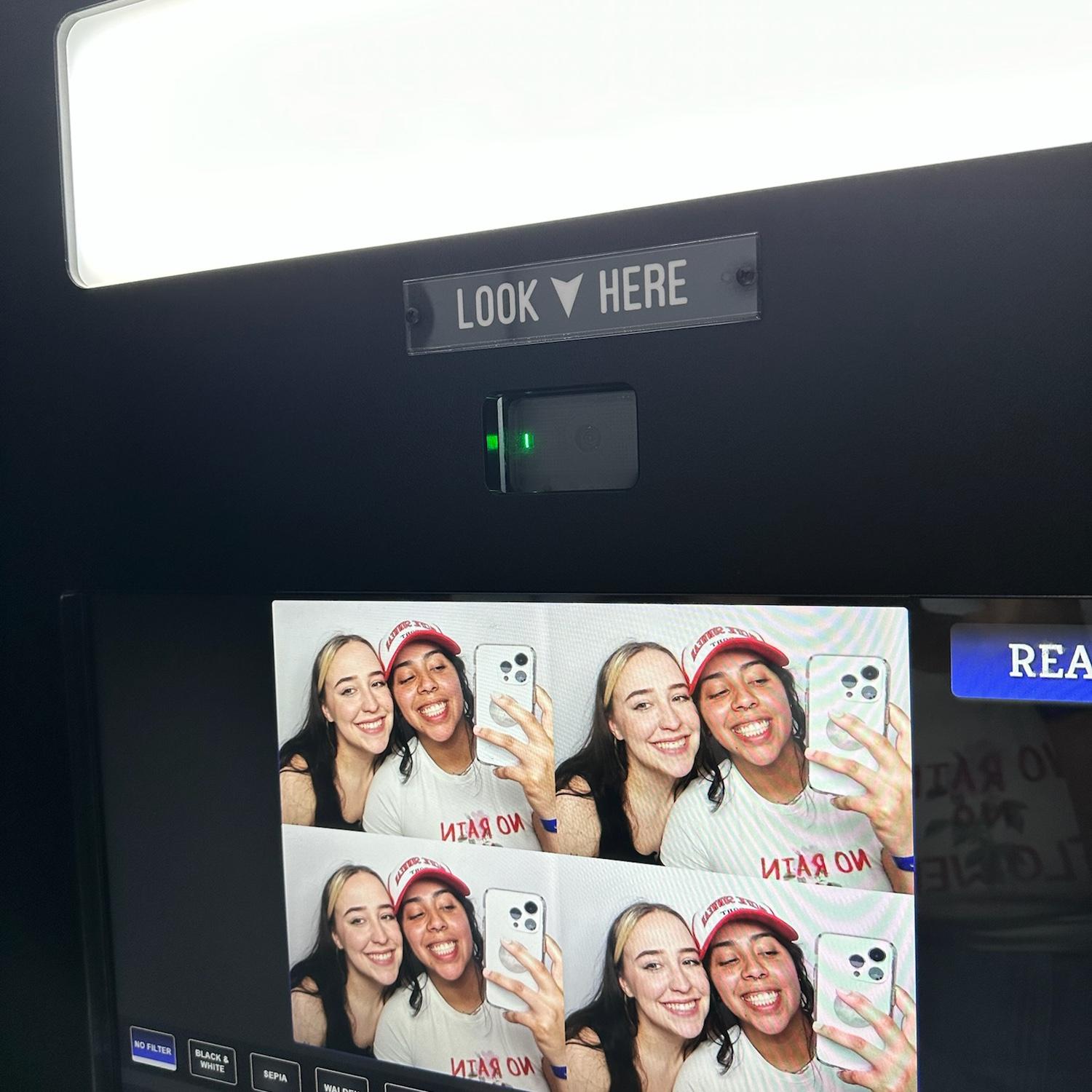 a photo booth hate to see us comin
