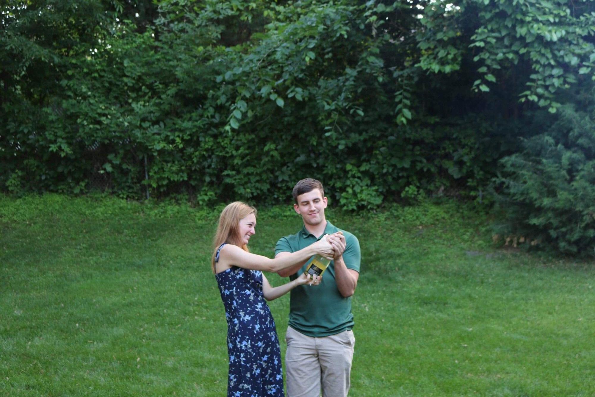 Popping champagne at our engagement party