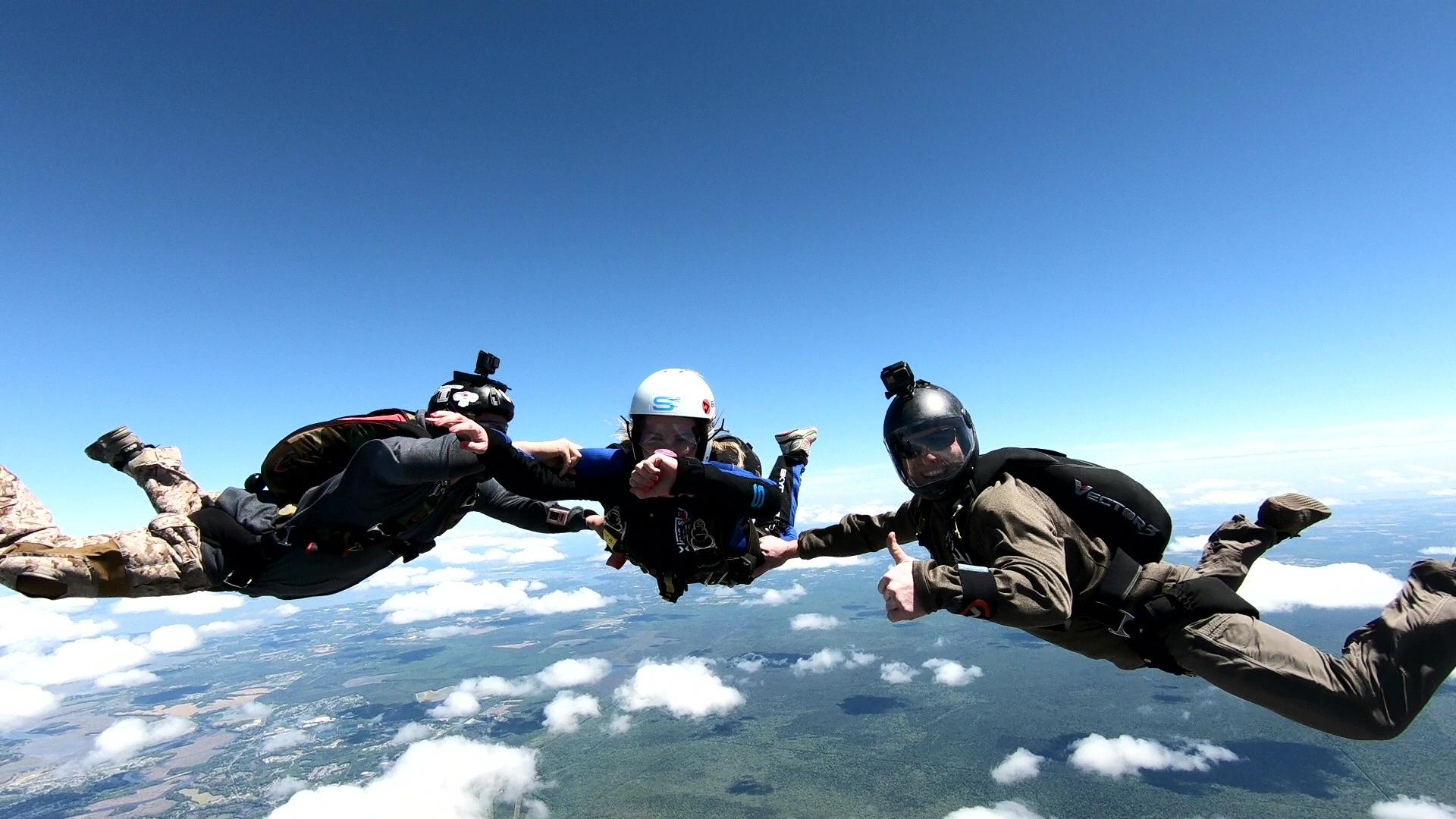 The first time we jumped out of a plane together, not attached!