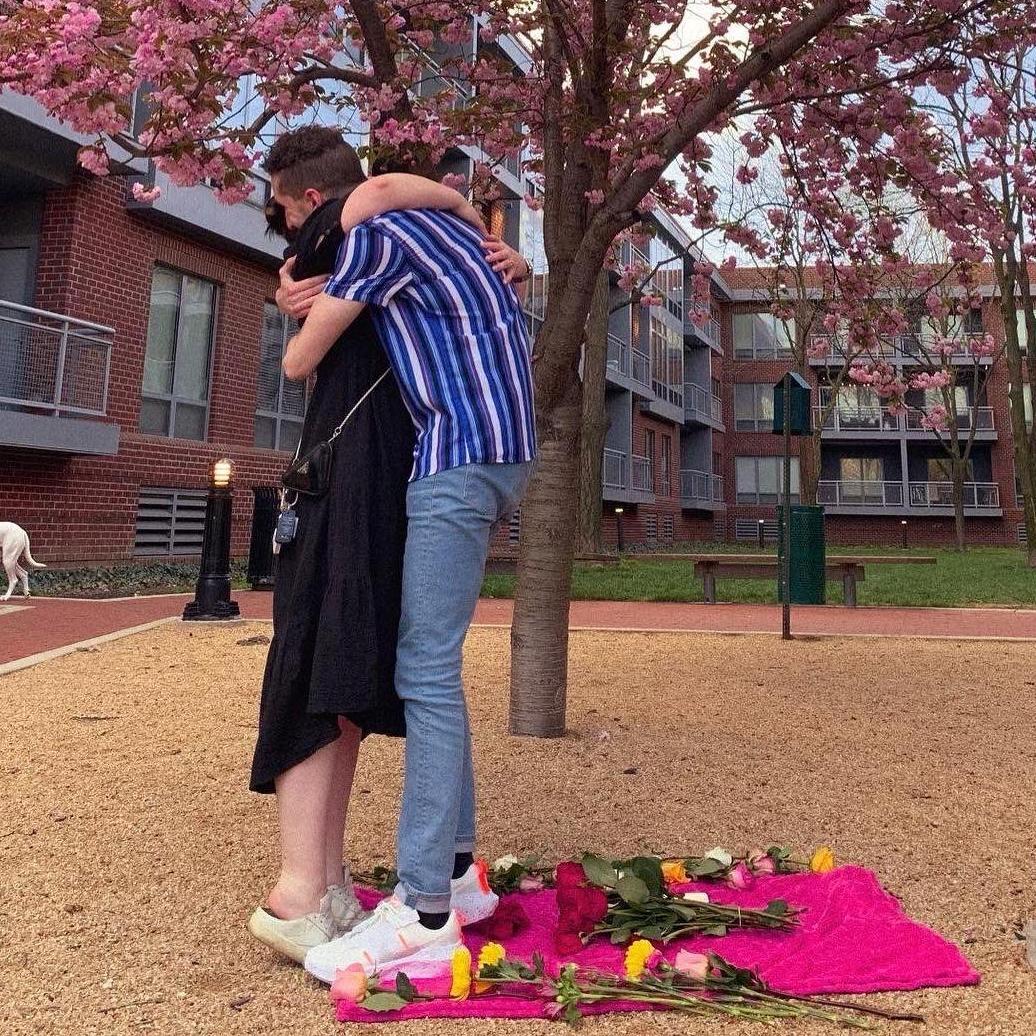 Our engagement! Matthew proposed outside of the apartment they shared, under a beautiful pink magnolia tree, surrounded by their closest family.