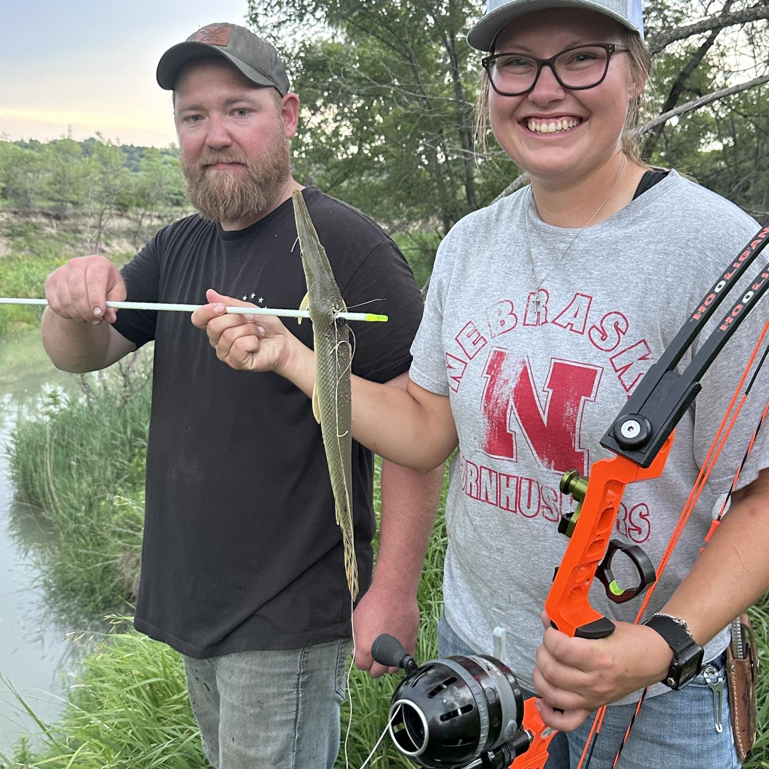 Katie went camping with Caleb's family 3 weeks after meeting them. This was the first fish she shot when Caleb was teaching her how to bowfish. (Later that night Katie shot a 29lb carp!)