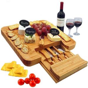 Bamboo Cheese Board & Cutlery Set with Slide-Out Drawer, 4 Piece Stainless Steel Knife, Charcuterie Plate & Serving Tray of Wine, Crackers. Includes 3 Label & Chalk, Fancy Wedding & House Warming Gift: Cheese Plates