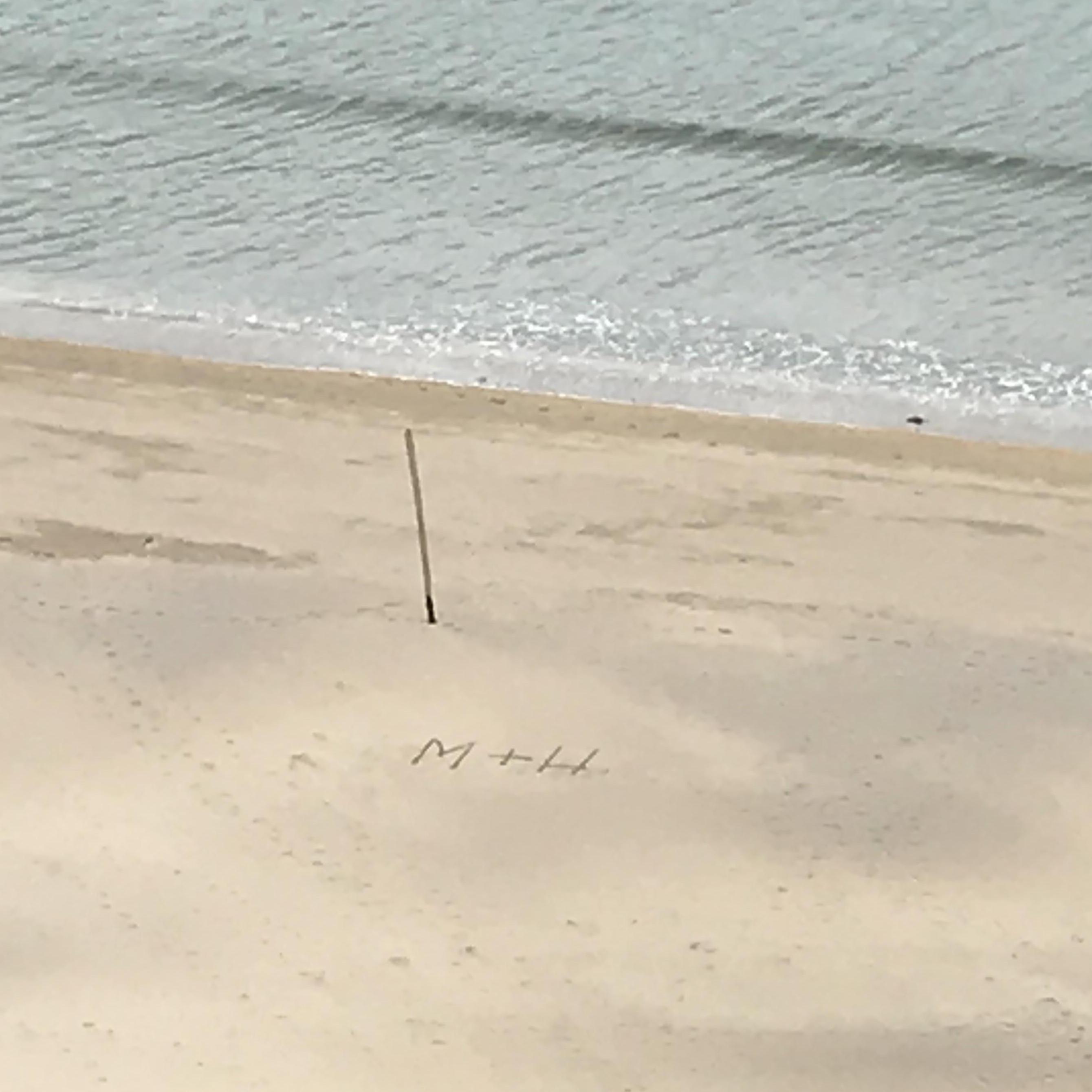 Our initials in the sand on the beaches of Ireland