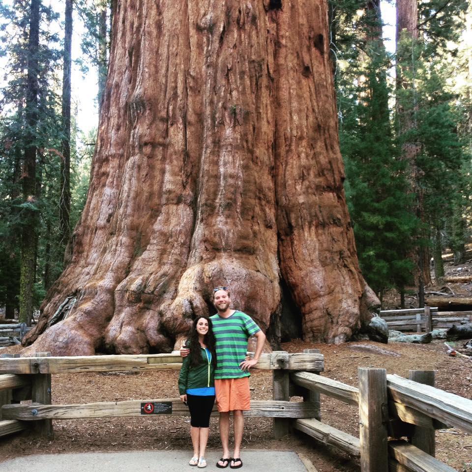 In front of the largest tree in the world, a giant sequoia named General Sherman, in Sequoia National Park.