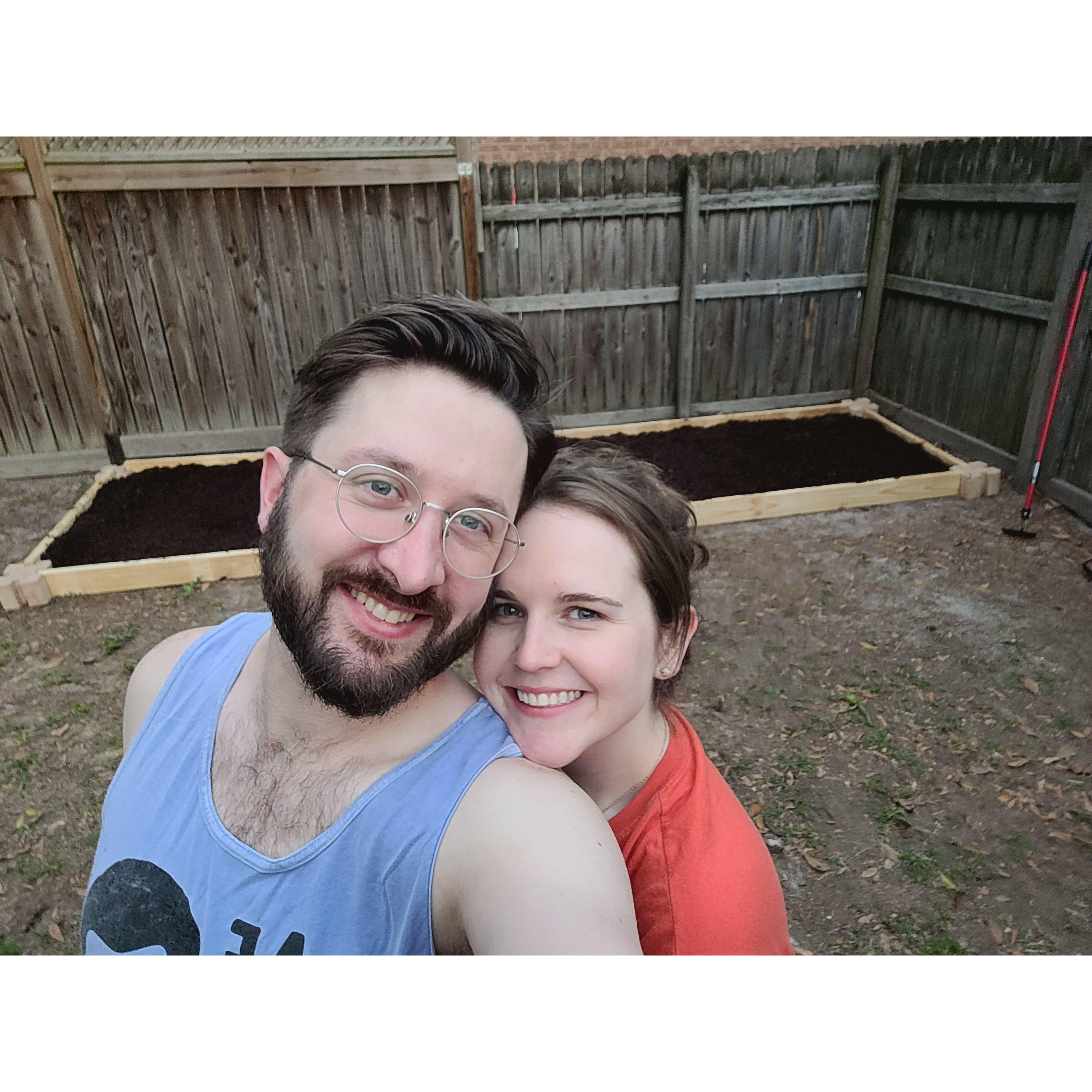 With our freshly built garden beds. Don't ask how our first growing season went.