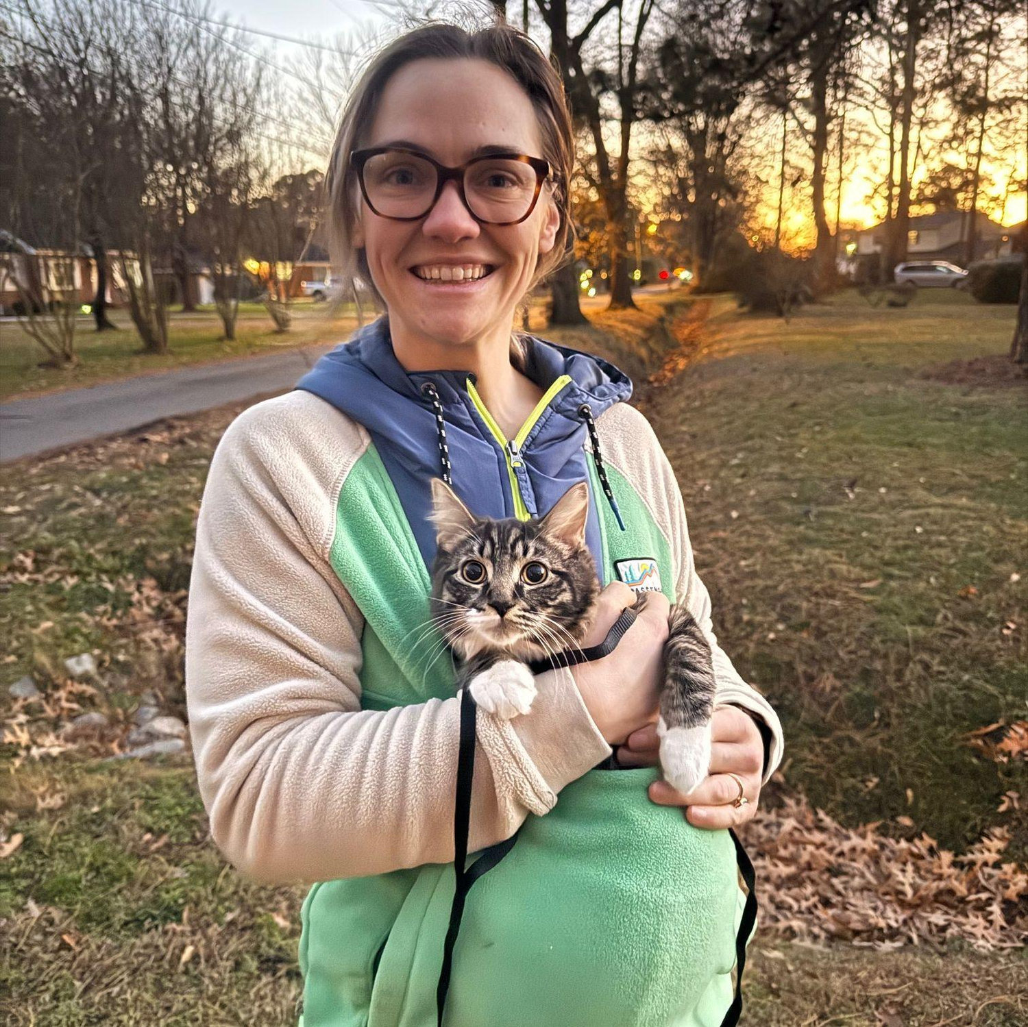 Victoria and Ozzy on a walk around the neighborhood, December 2025.
