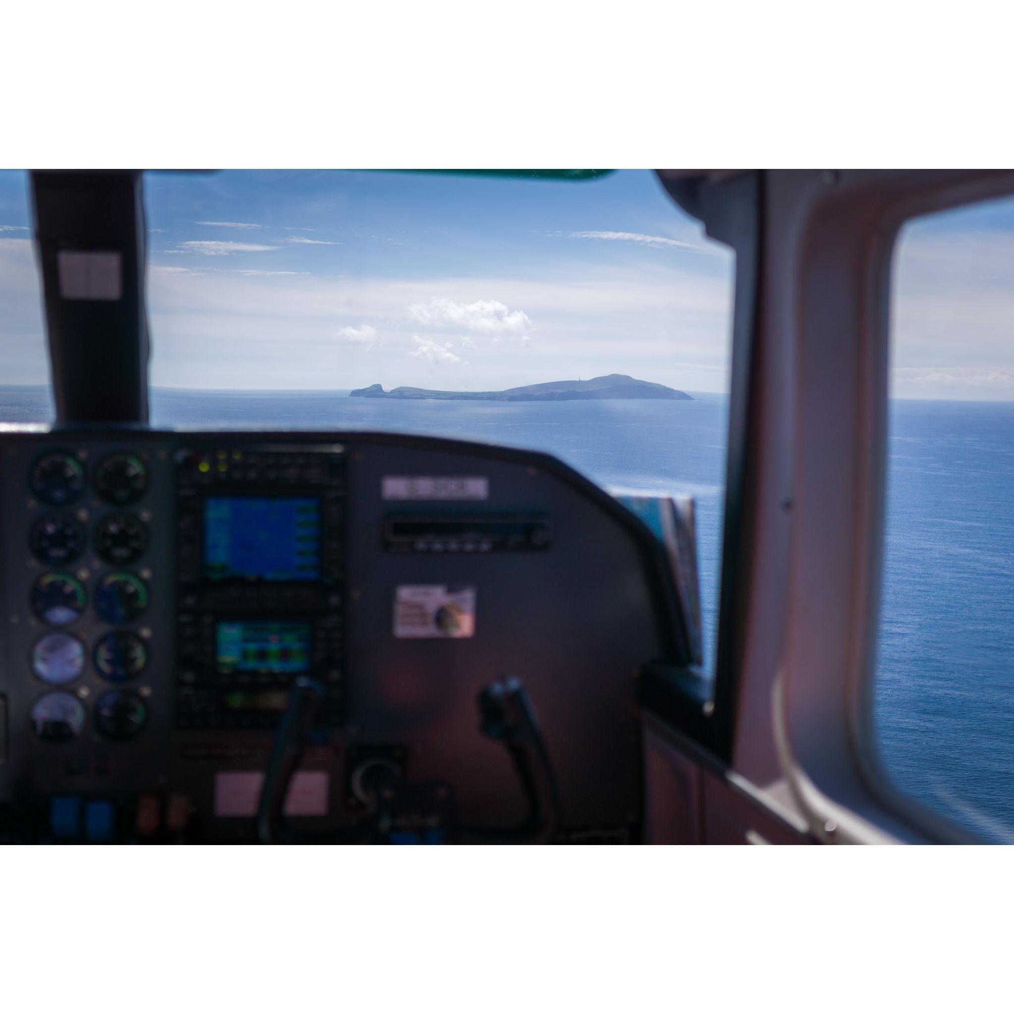 Fair Isle seen in the distance from the flight.