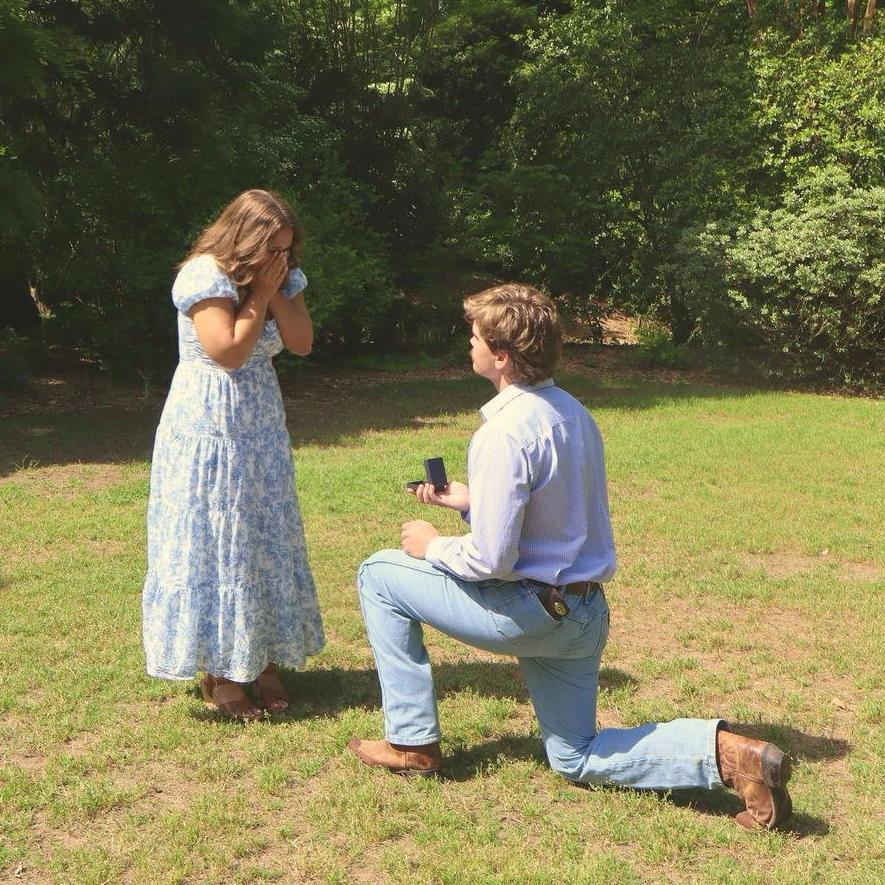 HE JUMPED OUT OF A BUSH AND POPPED THE QUESTION! I went to the Botanical Garden with friends to take pictures and Eli LITERALLY jumped out of a bush and asked for my hand. We were both shaking so bad!