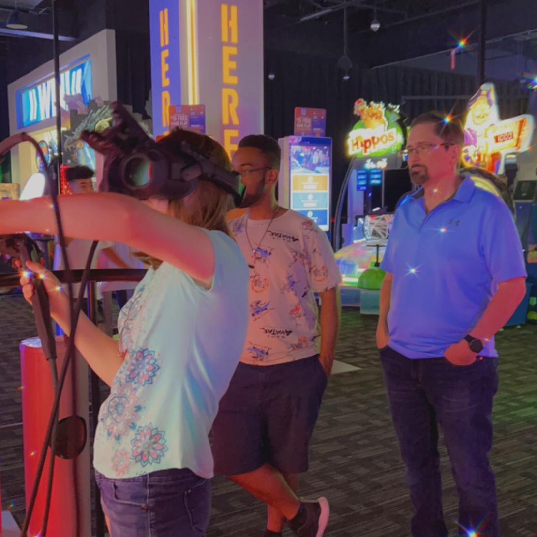 Brandon and Jon watching Katie with a virtual reality game...