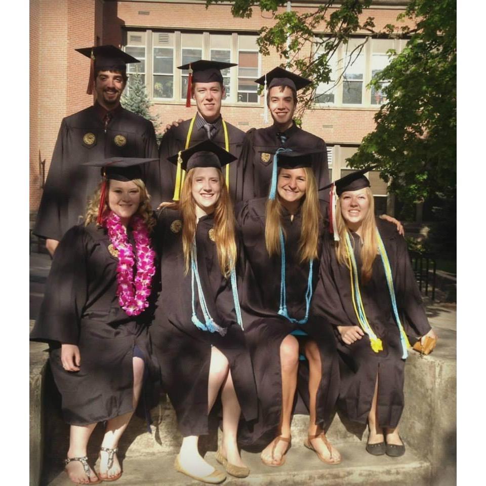Nicolas and Victoria are joined by their roommates for a celebratory graduation photograph to commemorate the special occasion. May 2014