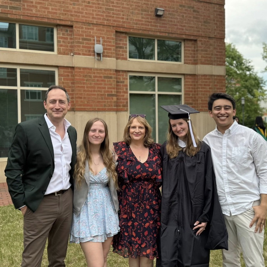 The bride & groom with the bride’s family during her master’s graduation