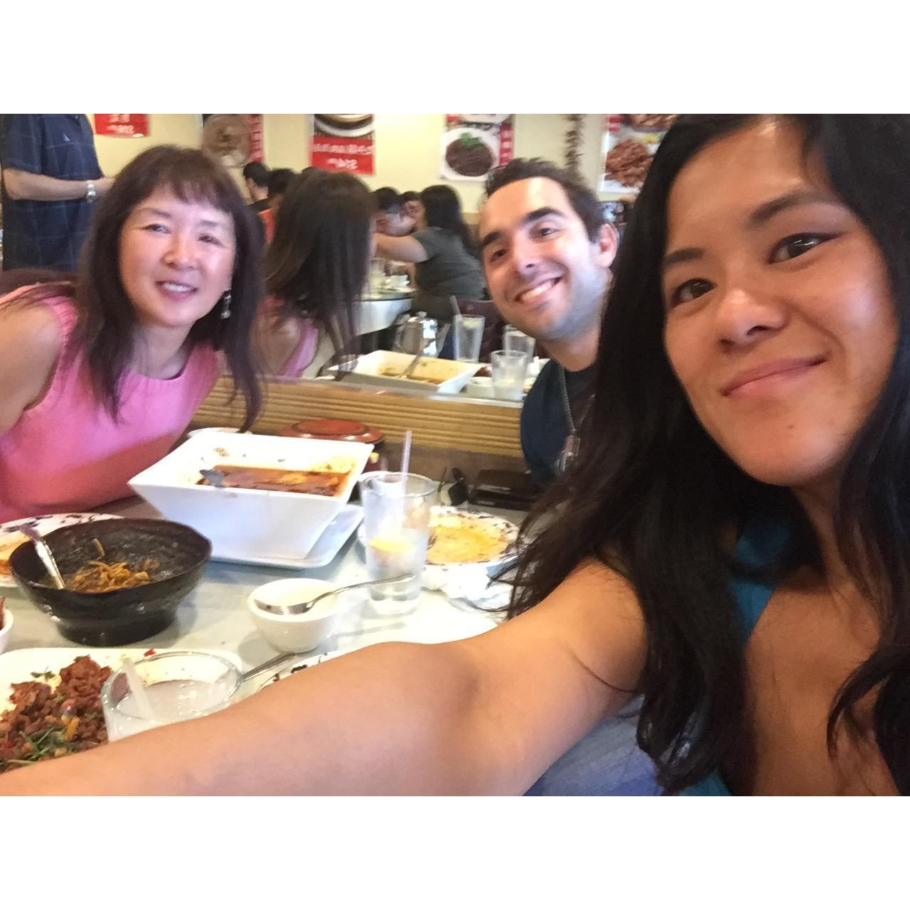 Aziz barely surviving super spicy Sichuan food, while meeting Helen's mom for the first time