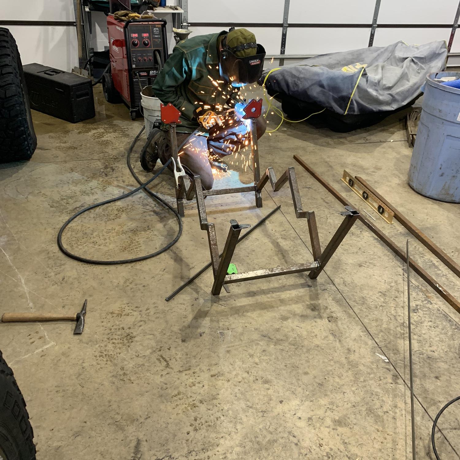 Riley working on the base of a coffee table for our home in Billings. April 2023