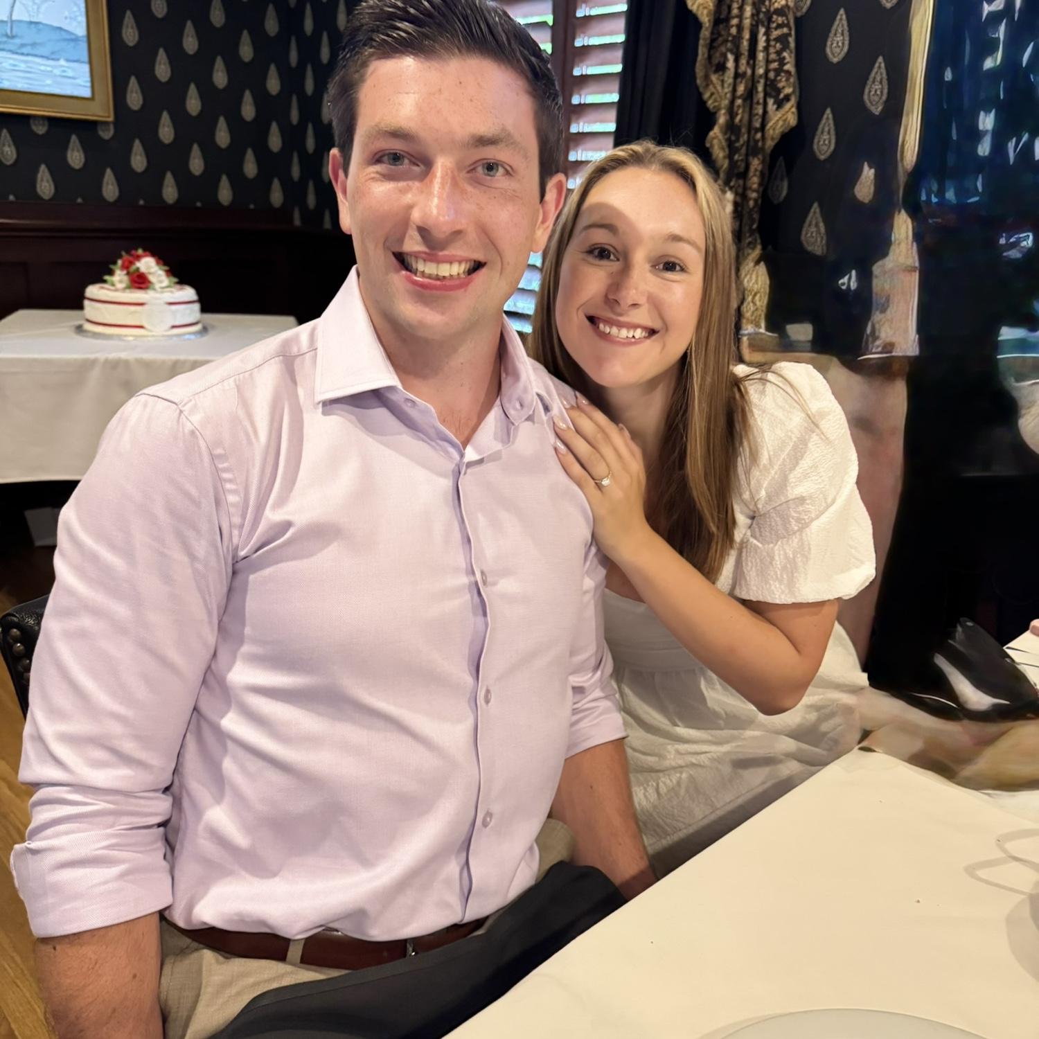 Kerry and Evan’s families threw them an engagement party after the proposal. In the background you can spot a delicious cake!