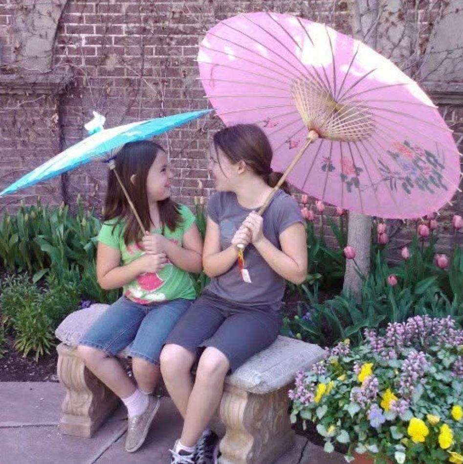 Emma and her sister Maren featuring their new umbrellas.