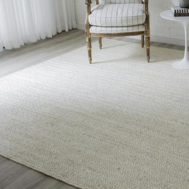 Hand woven natural area rug