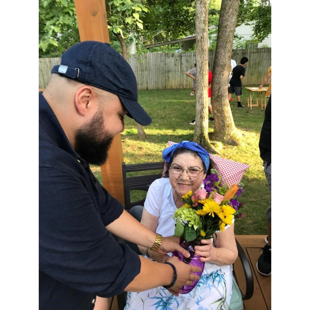 Ramon bringing mami flowers on the last birthday we spent with her here with us.