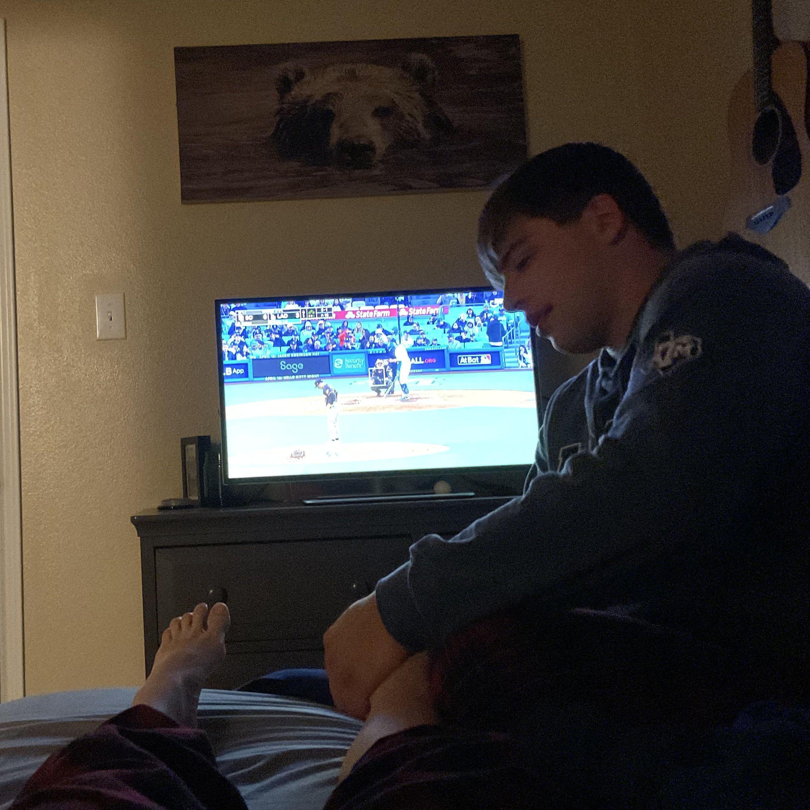 Giving Kylee a foot massage while watching the Dodgers. Ben lives a good life. Kylee does too lol.