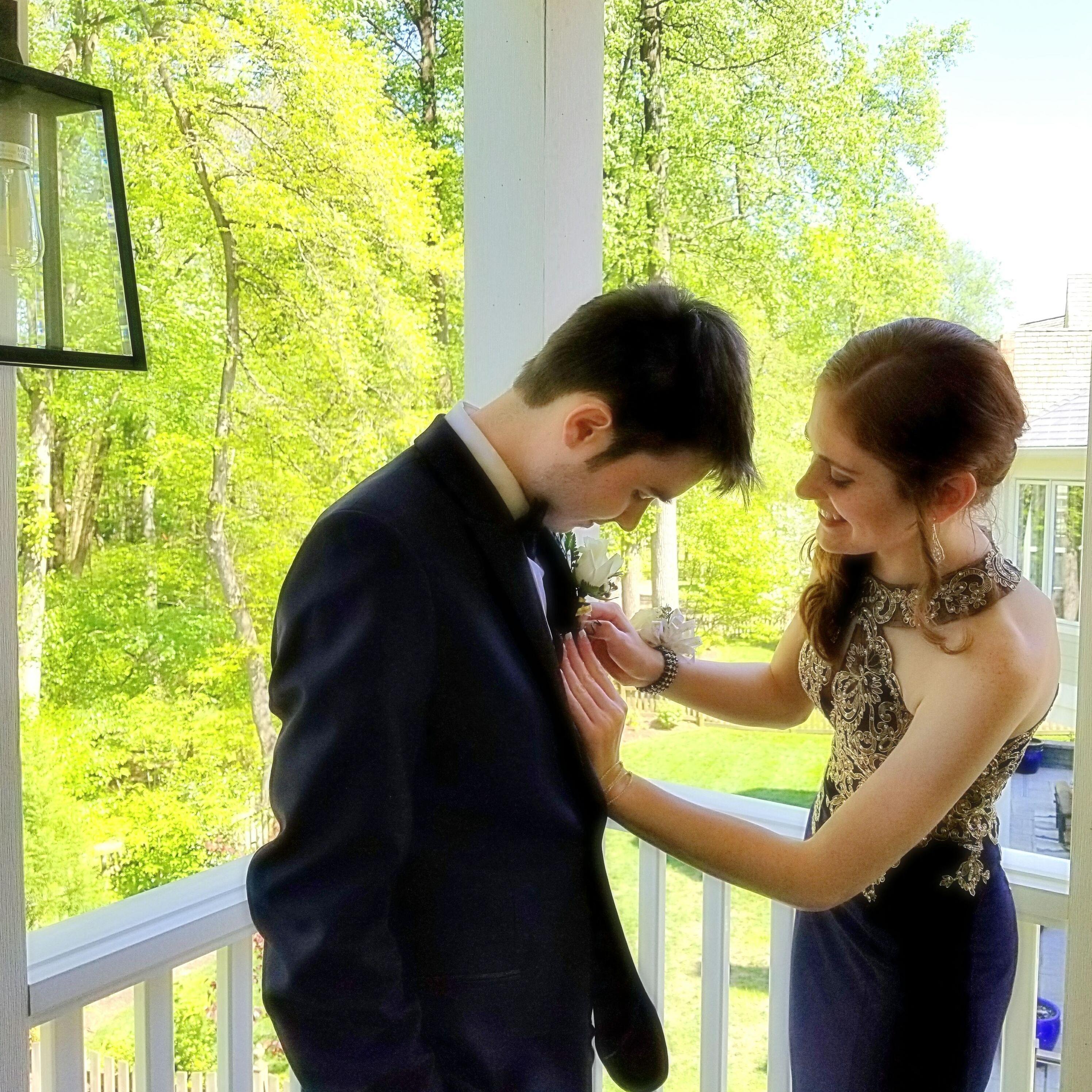 Danni is unsure how to pin a boutonniere