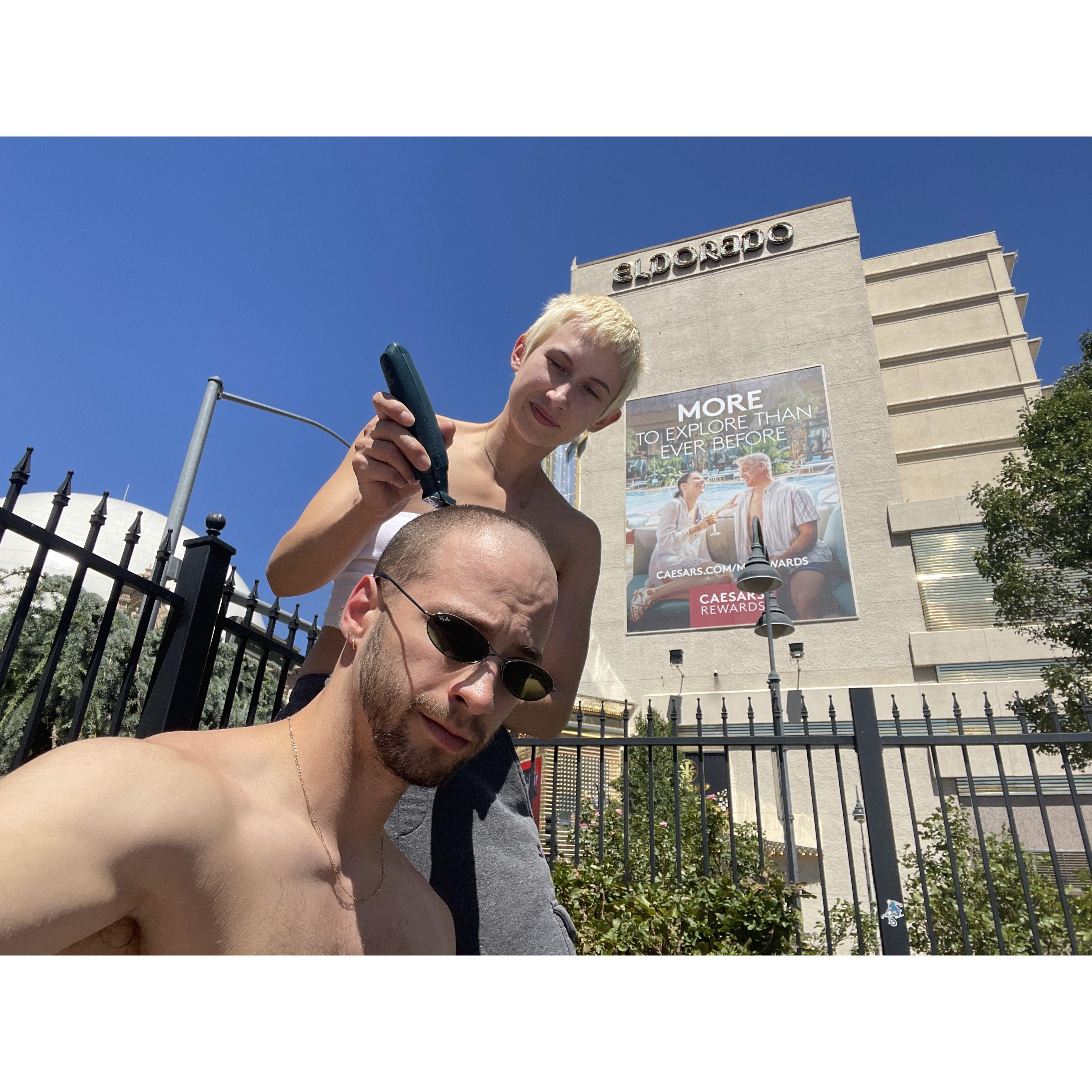 Shaving Adam's head on our 2nd cross country road trip together. Reno, NV. 2021.