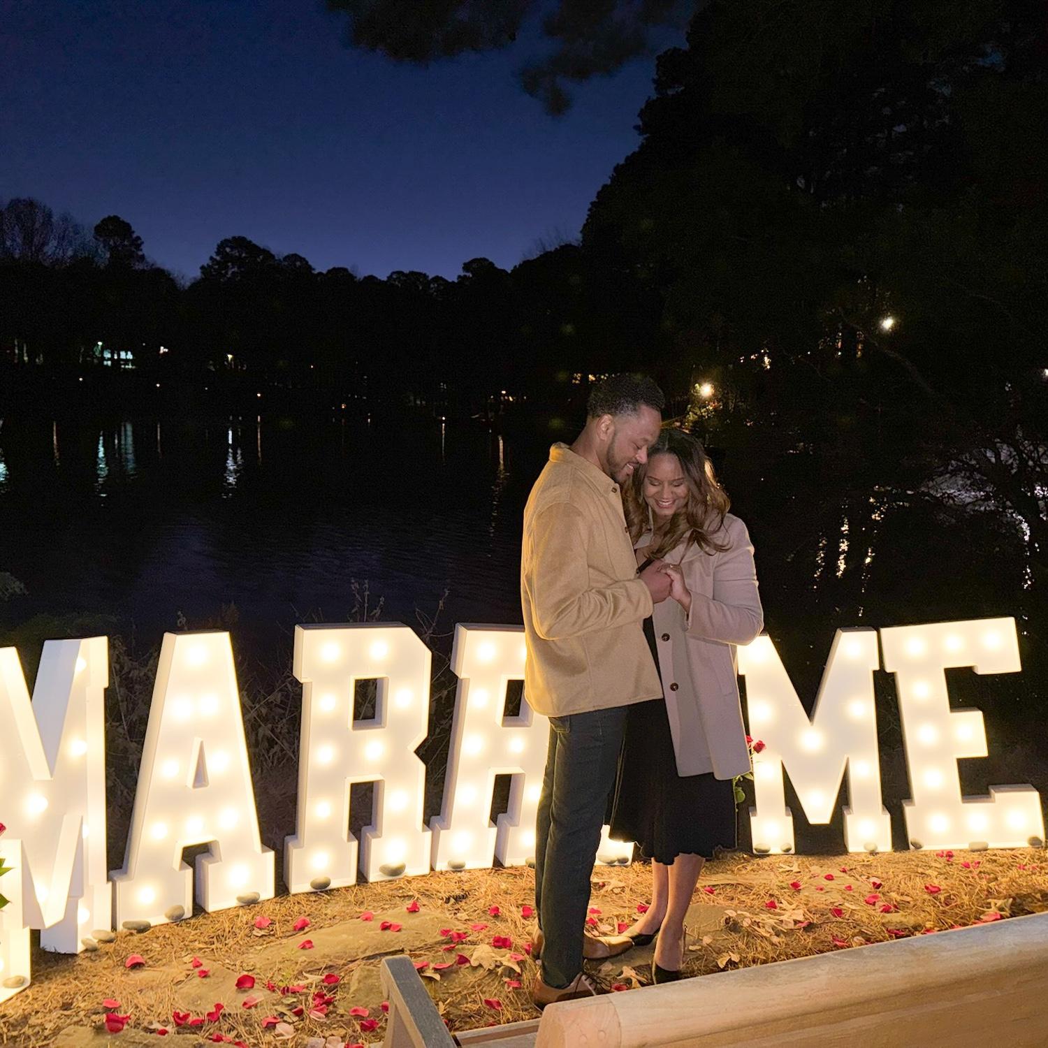 They’re engaged! 12.21.2025 at The Umstead in Cary, NC. Did you know that Joe made those letters from scratch?