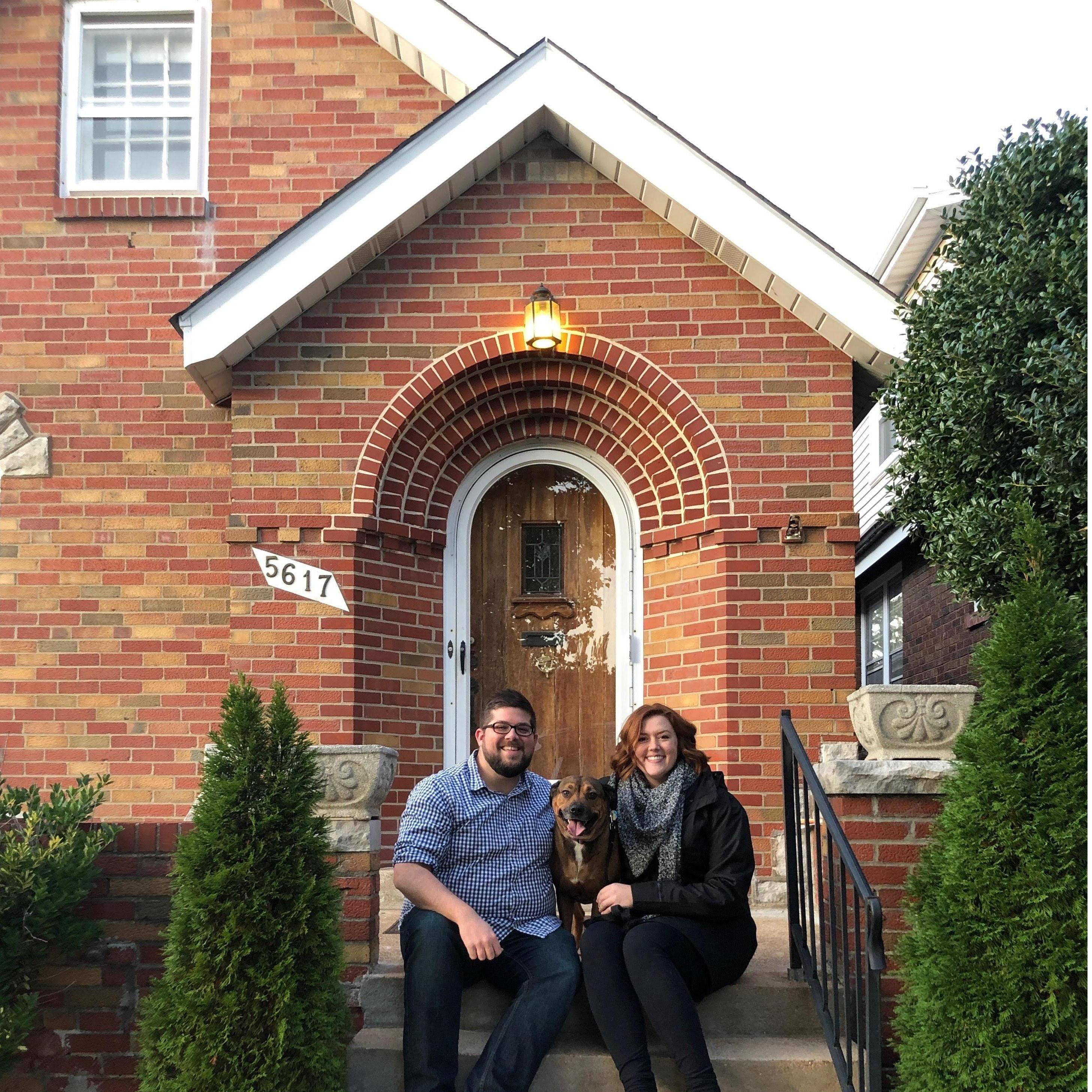 In front of our house with our dog, Marge.