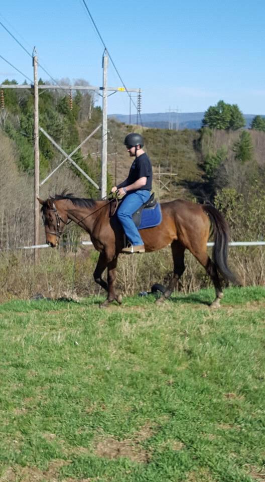 Matthew riding his horse Alex