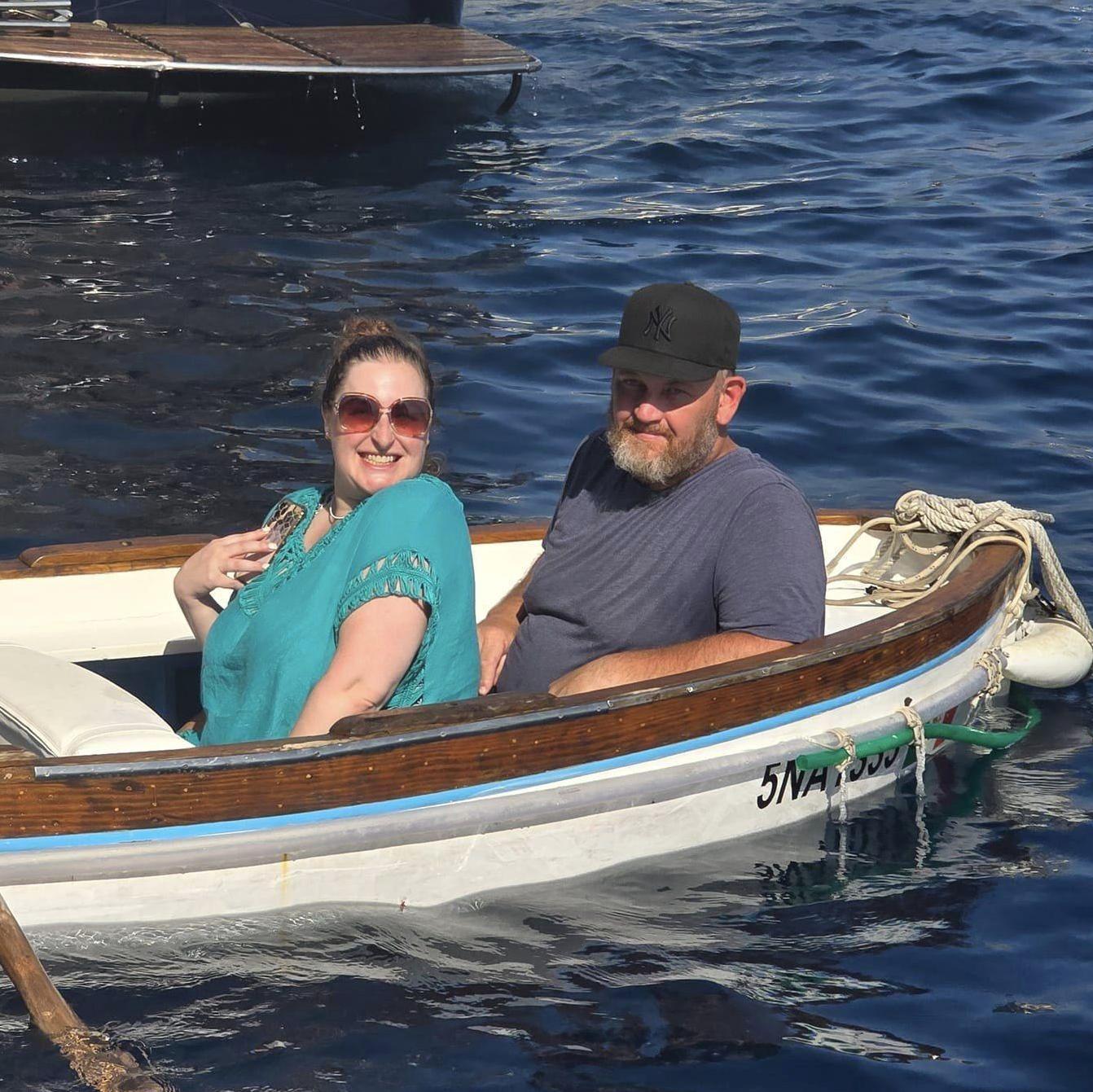 We love to travel! Here we are waiting our turn to see the Blue Grotto on the Amalfi Coast