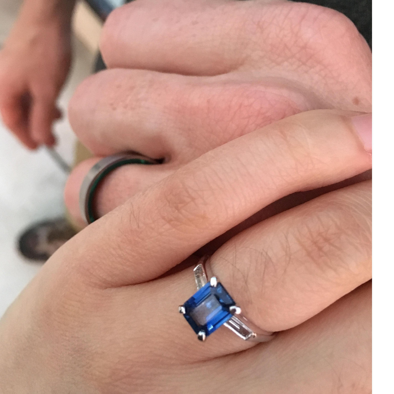 The setting is from Glenn's grandmother's engagement ring, which became Betsy's engagement ring, and is now Amy's. Glenn's ring is tungsten lined with malachite.