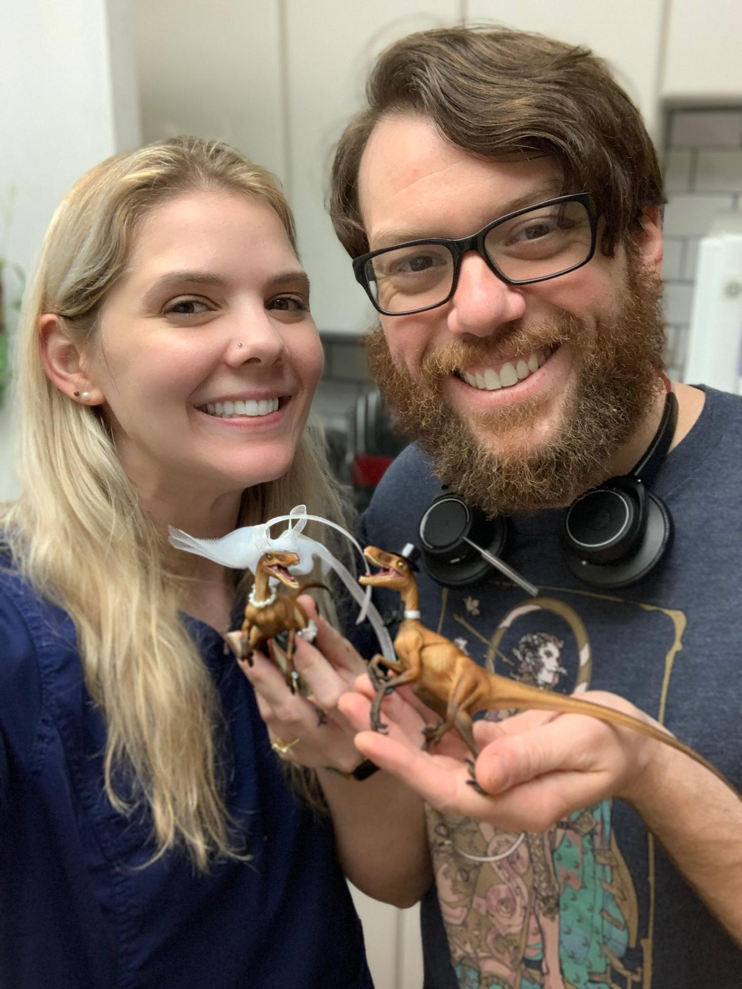 Just a couple of nerds with velociraptor cake toppers