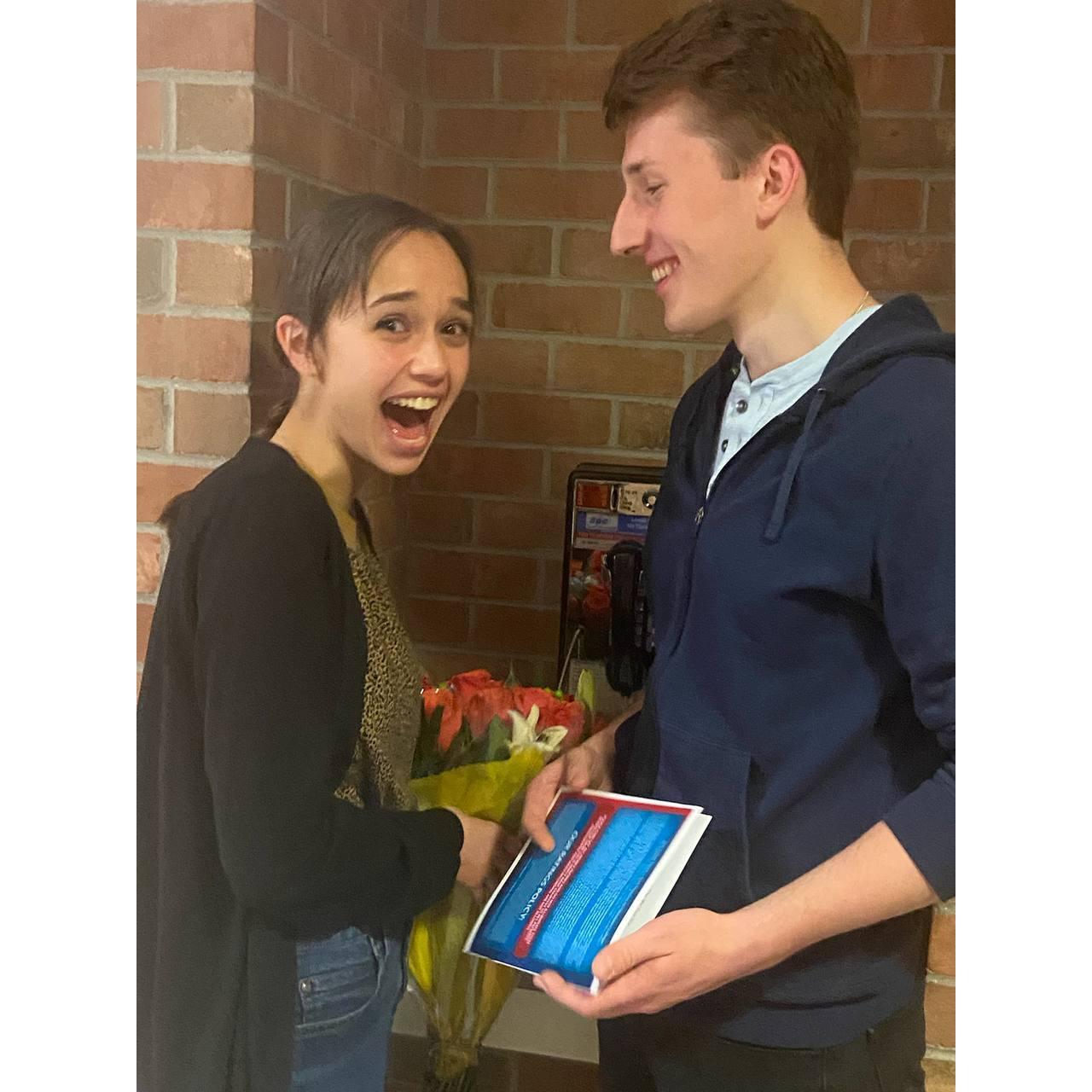 Tomek bringing roses to Lucy's dance performance