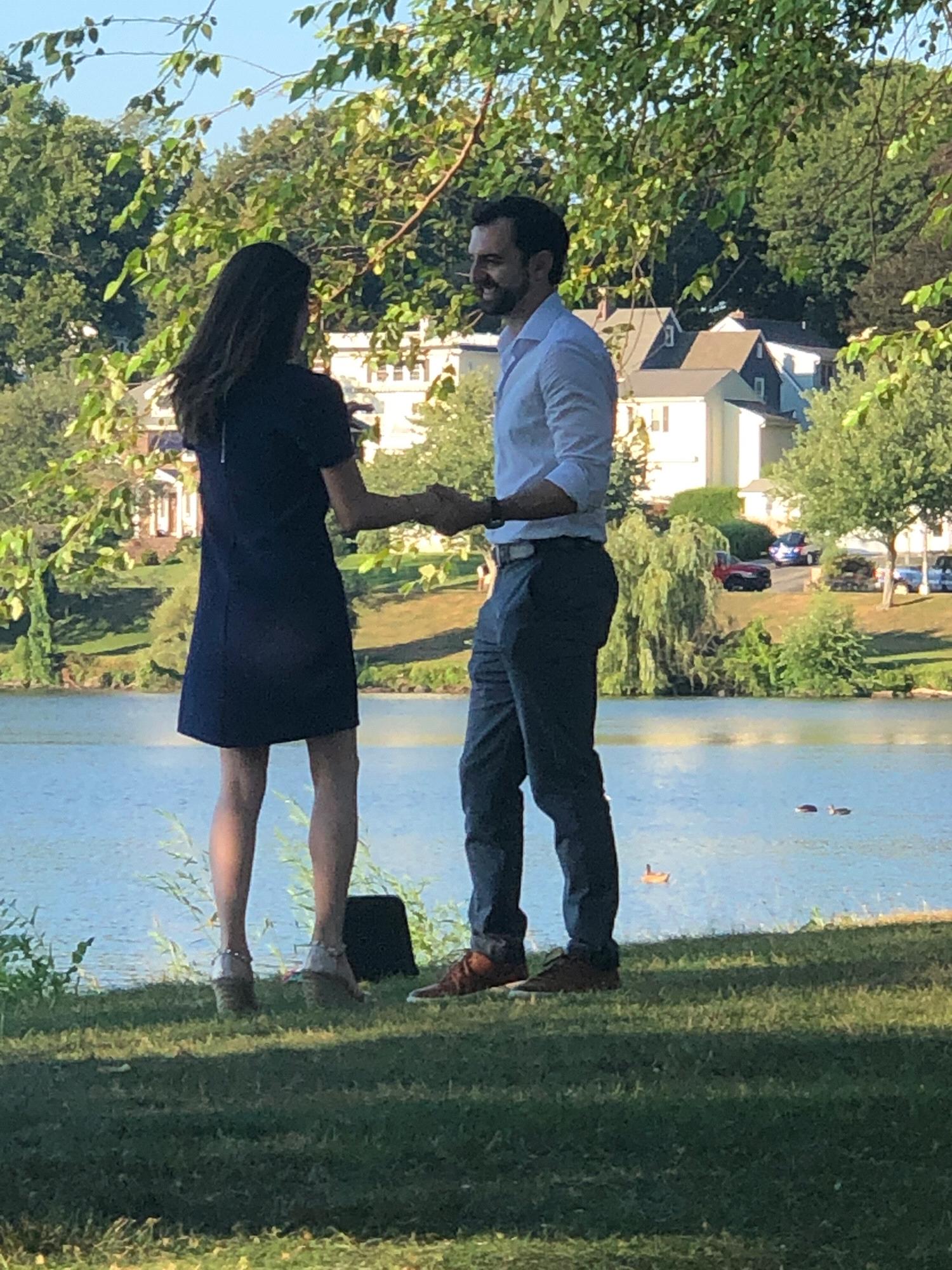 Action shot of the proposal by the lake