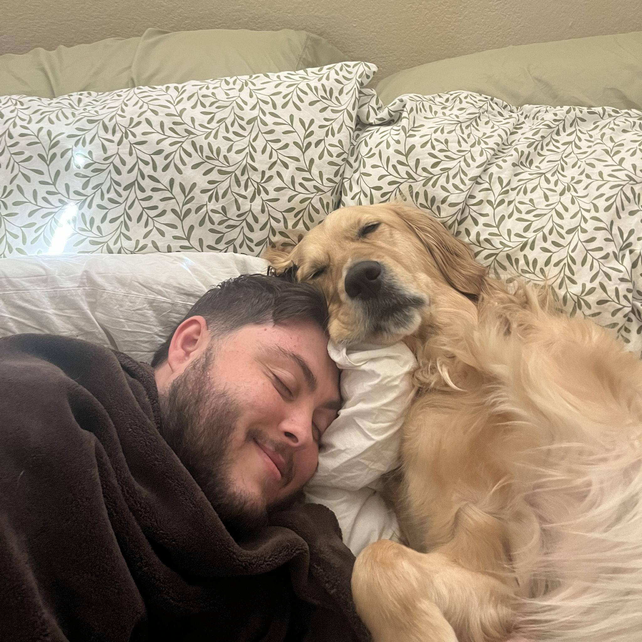 Moose loves to hog Trevor’s love… or maybe just the bed. - Phoenix