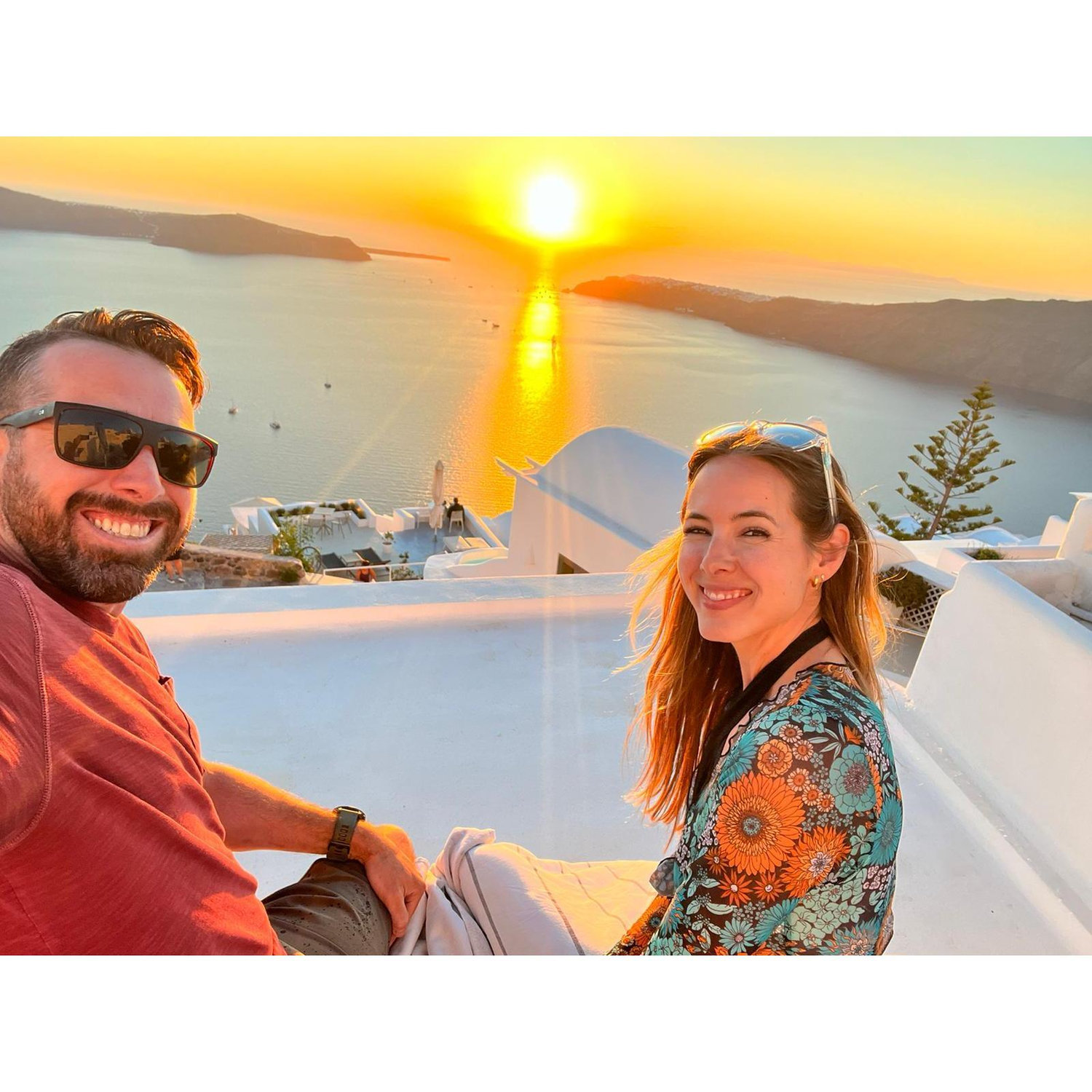 Watching the sunset on our first trip together in Santorini, Greece.