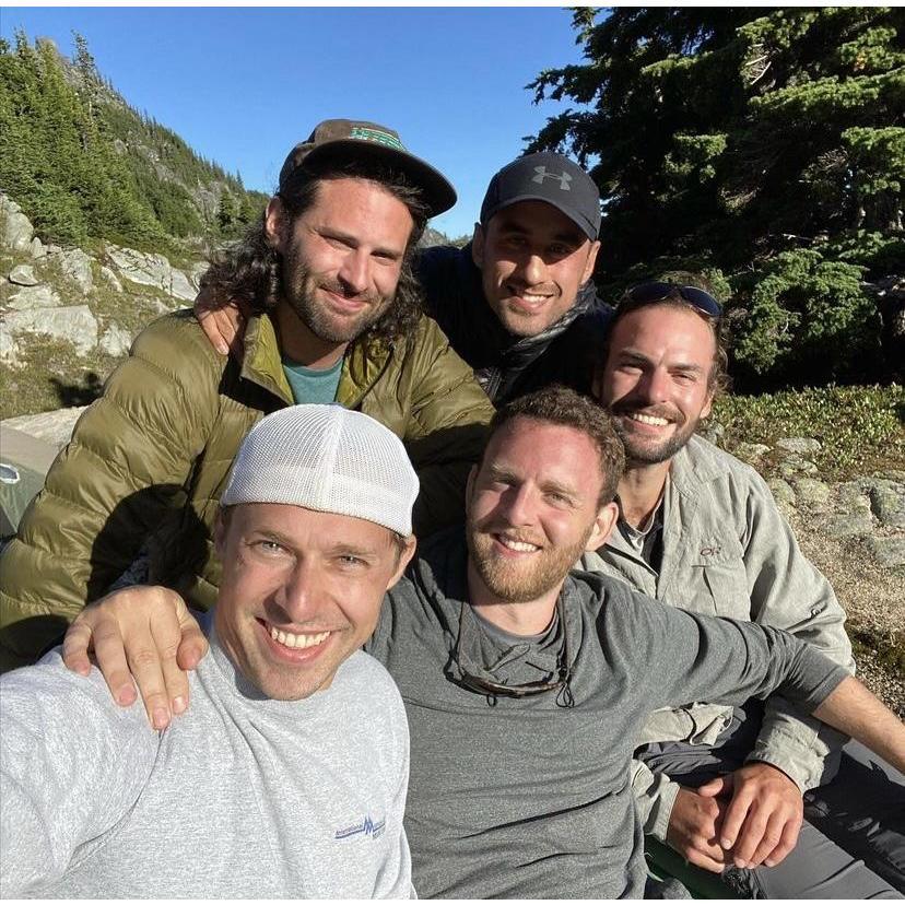 Trevor with his friends on a backpacking trip