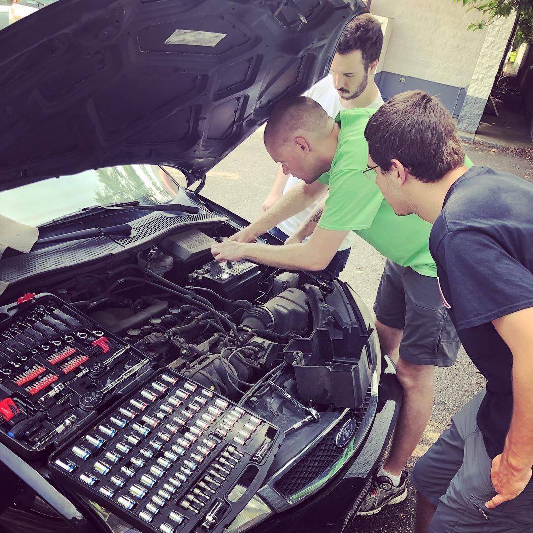 All of our brothers trying to figure out what's going on with the car...we got it! Eventually!