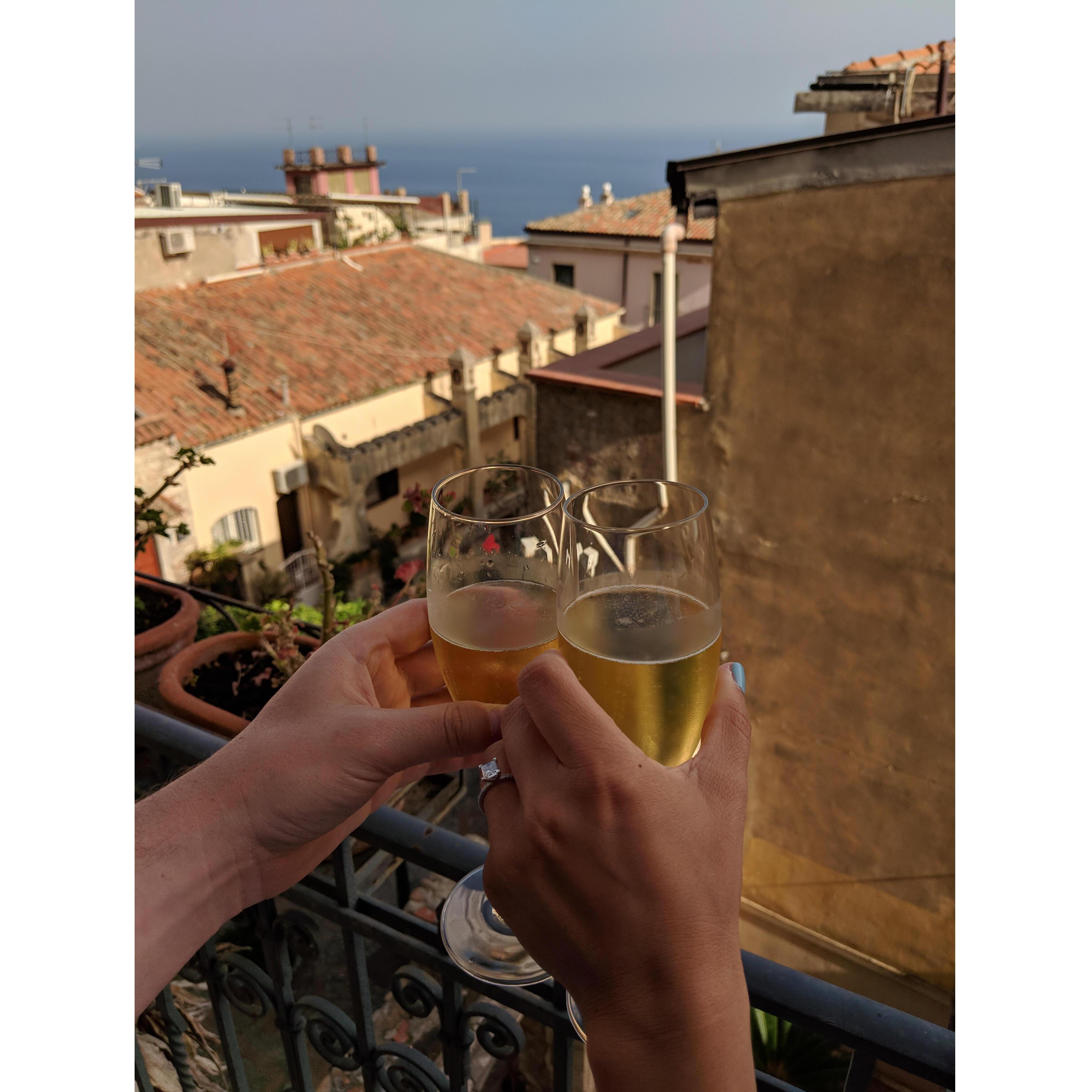 Celebrating our engagement with Prosecco, Taormina Sicily, July 2018