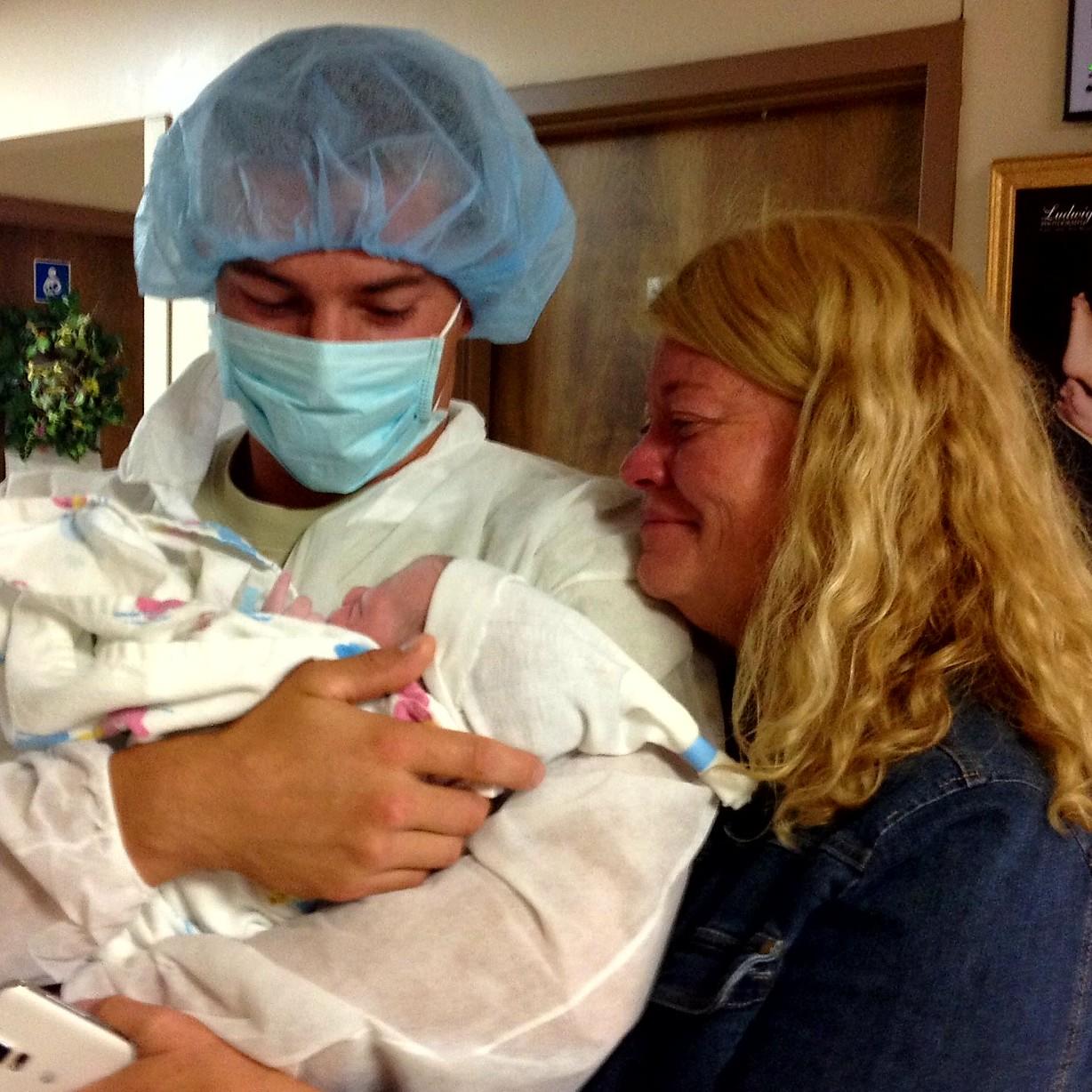 August 14th 2015 - Laramie, Wyoming - Proud dad Jason holding newborn son Jaxson while Grandma Denice looks on adoringly!