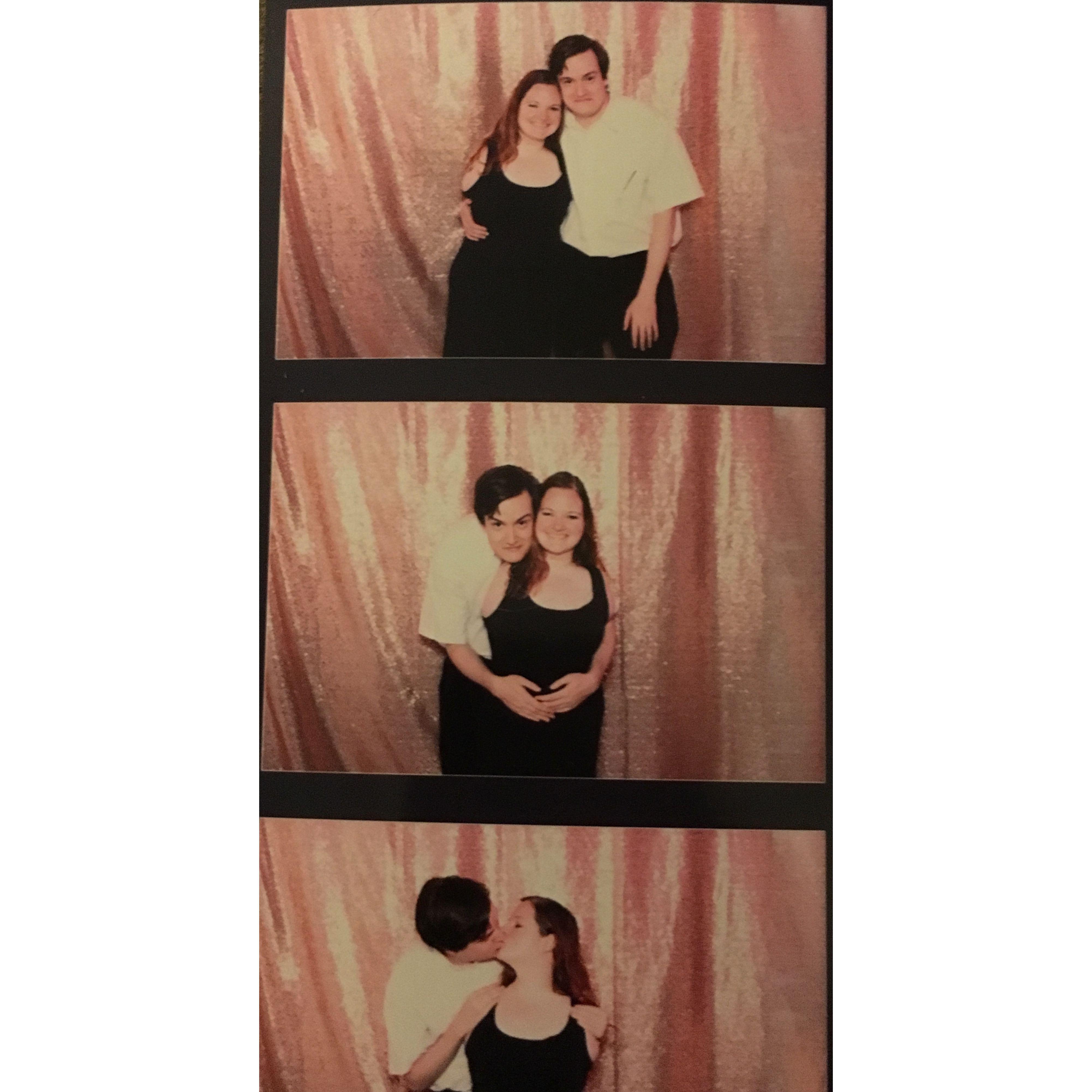 3 photos from a photo booth. Photo 1: they stand together and smile. Photo 2: Zac hugs Olivia from behind and leans his head to rest on her shoulder. Photo 3: They stand and kiss over Olivia’s shoulder