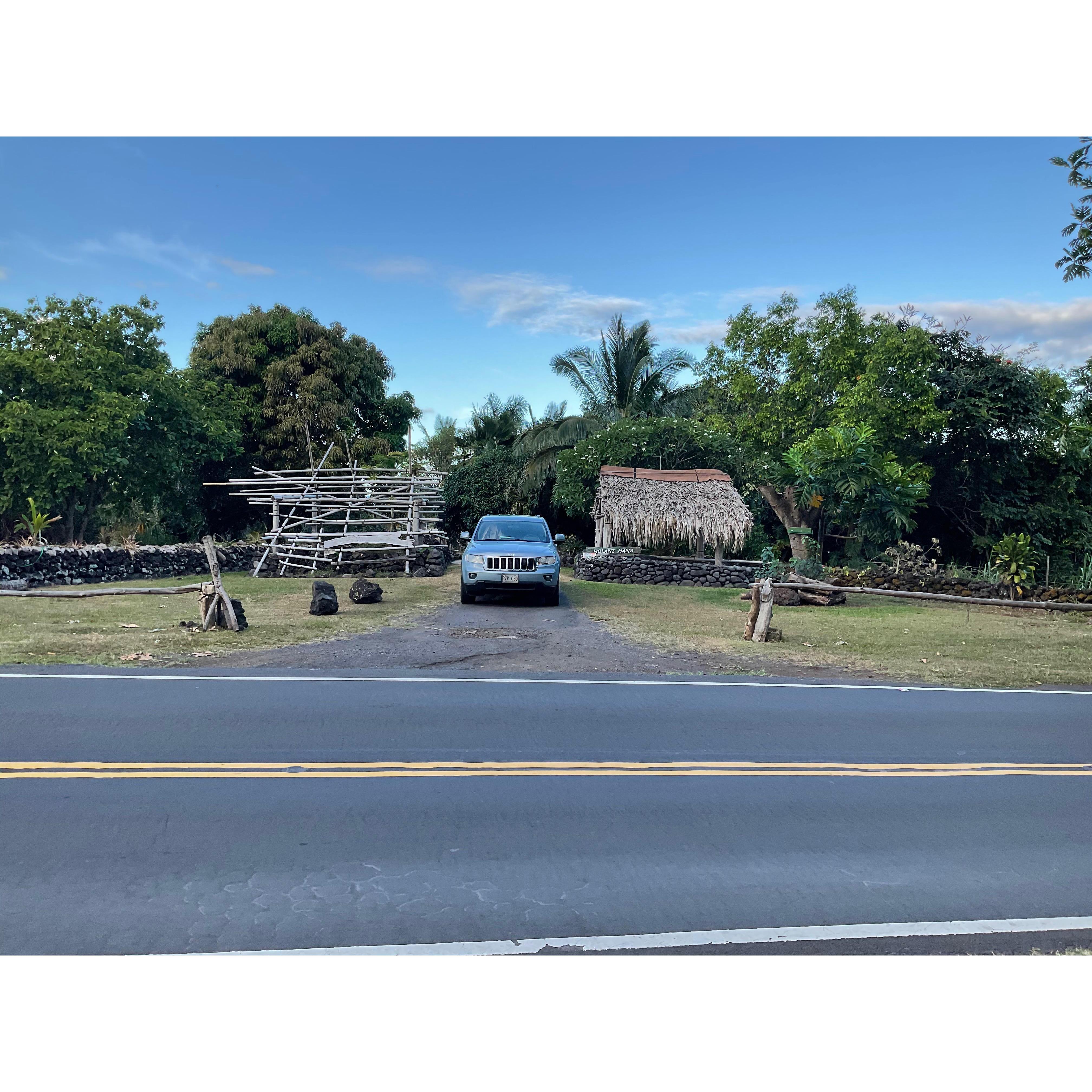 Please pull into this driveway where you see our car pulling out in the picture.