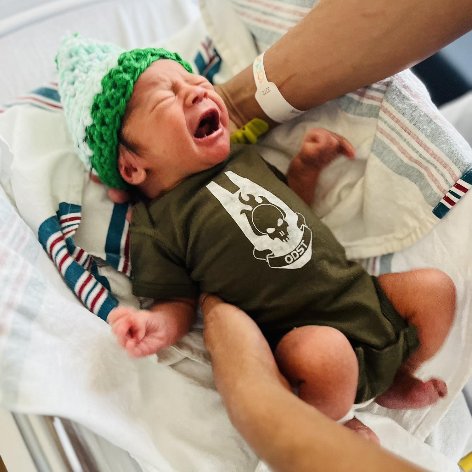 Bought Ian this ODST onesie for baby Jeffrey lol. This was the first outfit we put him in.