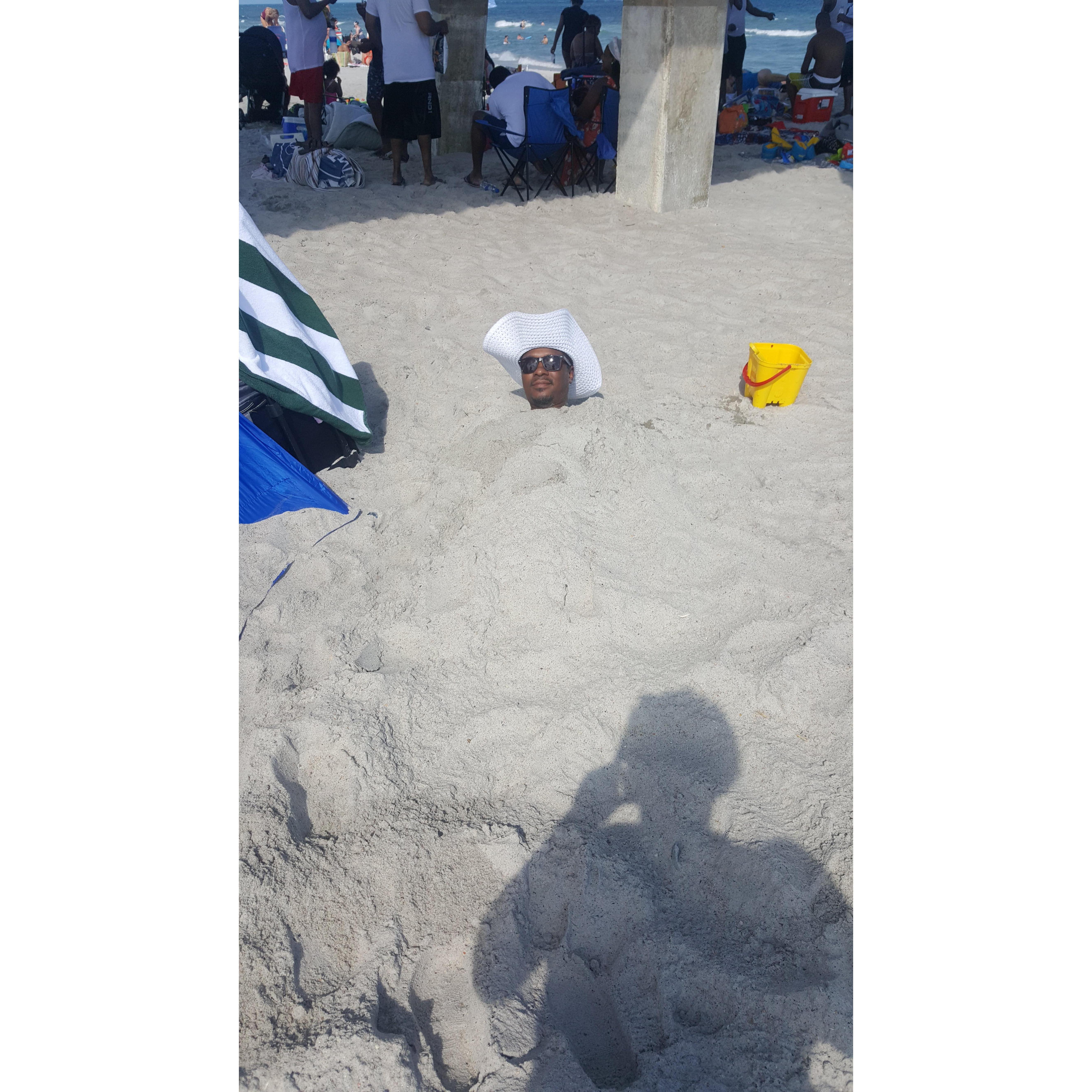 Louis buried at the beach
