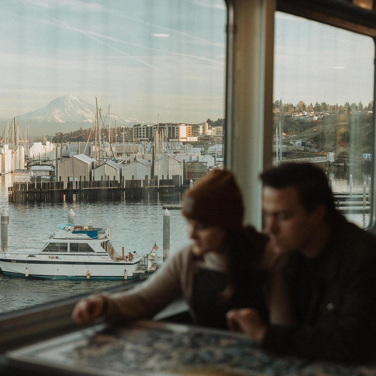 Engagement photos by In the Alpenglow on the Vashon Island ferry in Wahington in the fall of 2023.