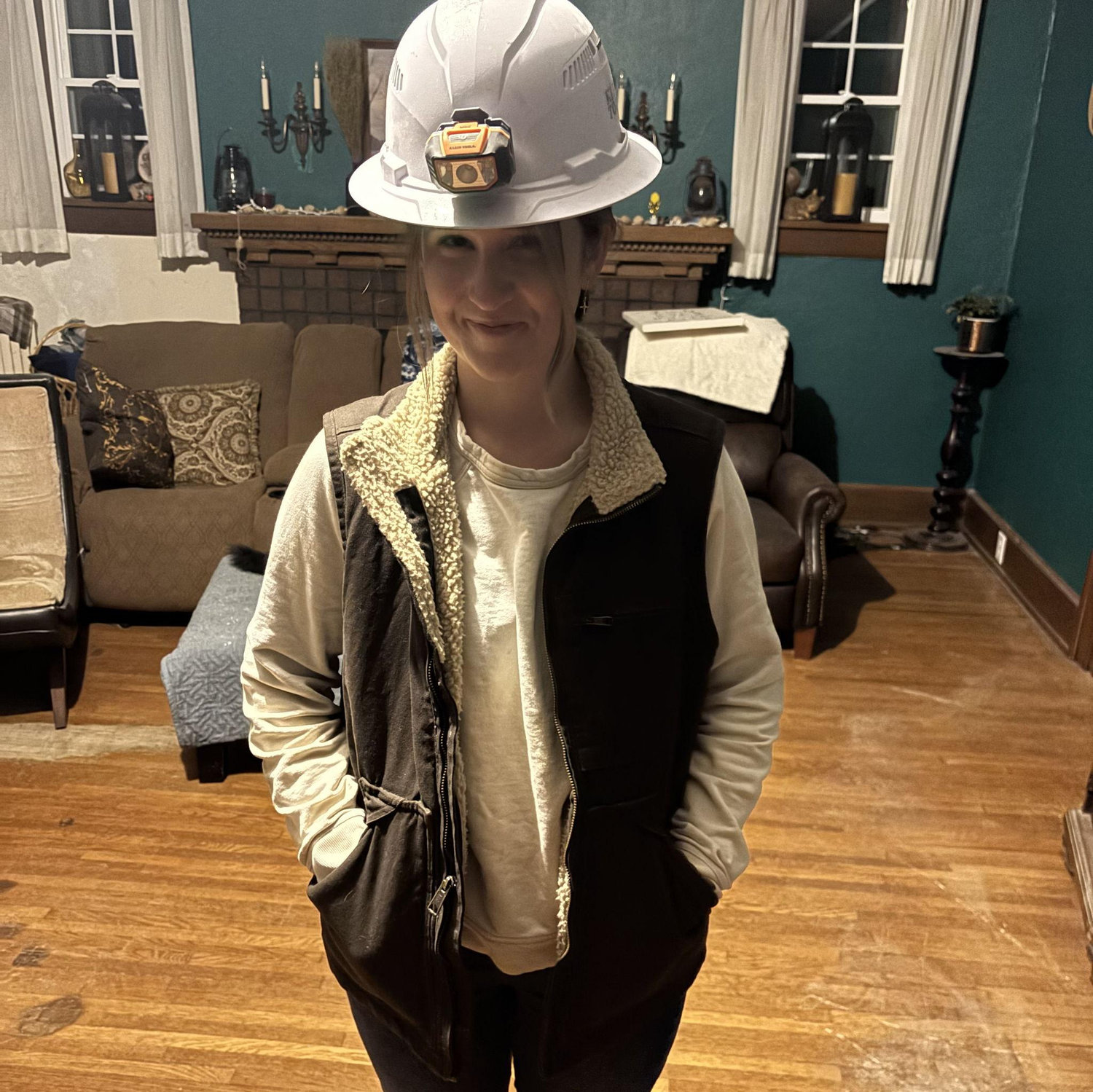 Melody doing her best to be an electrical apprentice (she doesn't know what she's doing)