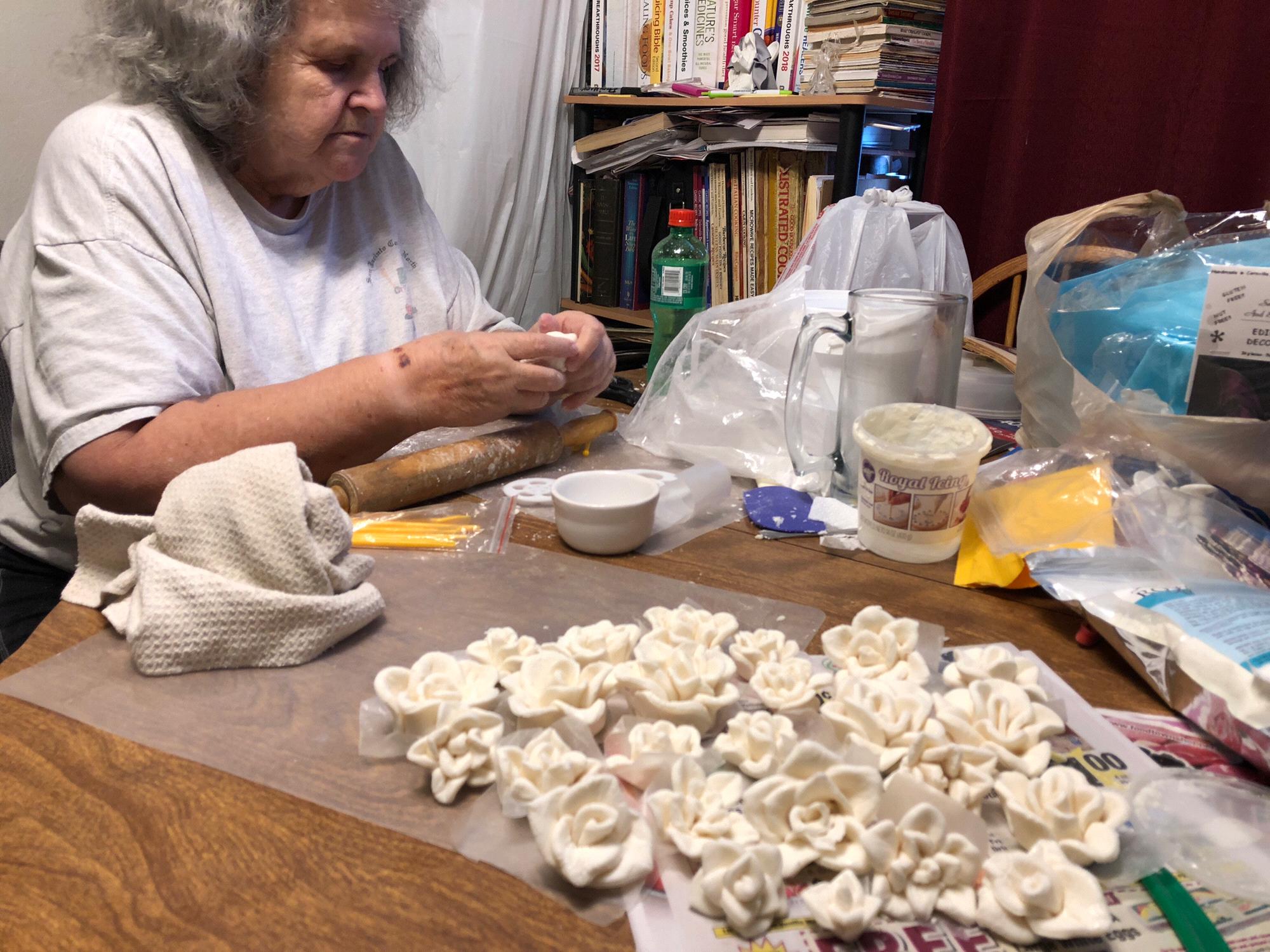 Wedding cake prep... working on flowers. Gum paste and Royal Icing...edible decorations...